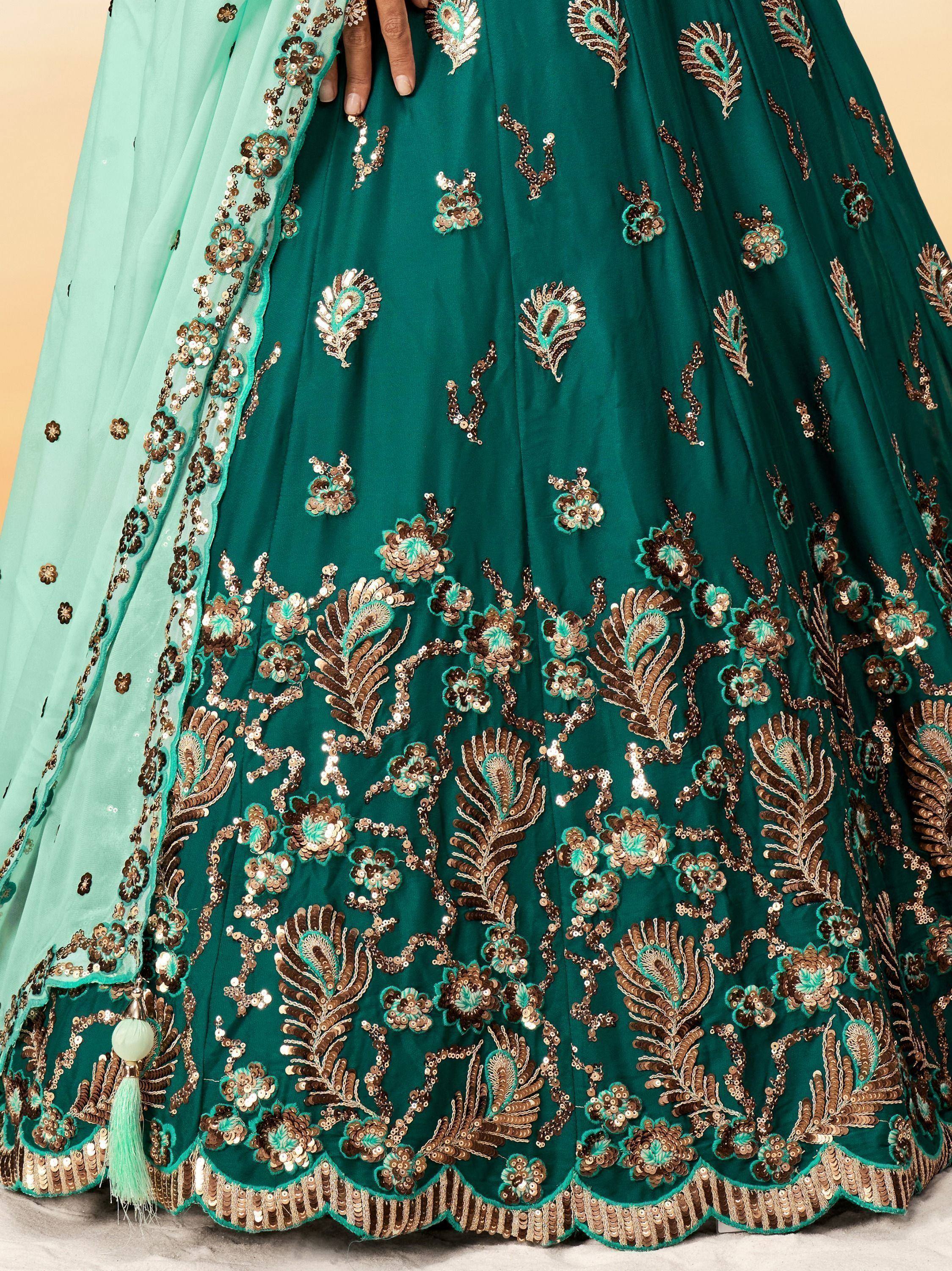 Emerald green lehenga with gold and turquoise sequin embroidery, floral and peacock motifs, matching dupatta