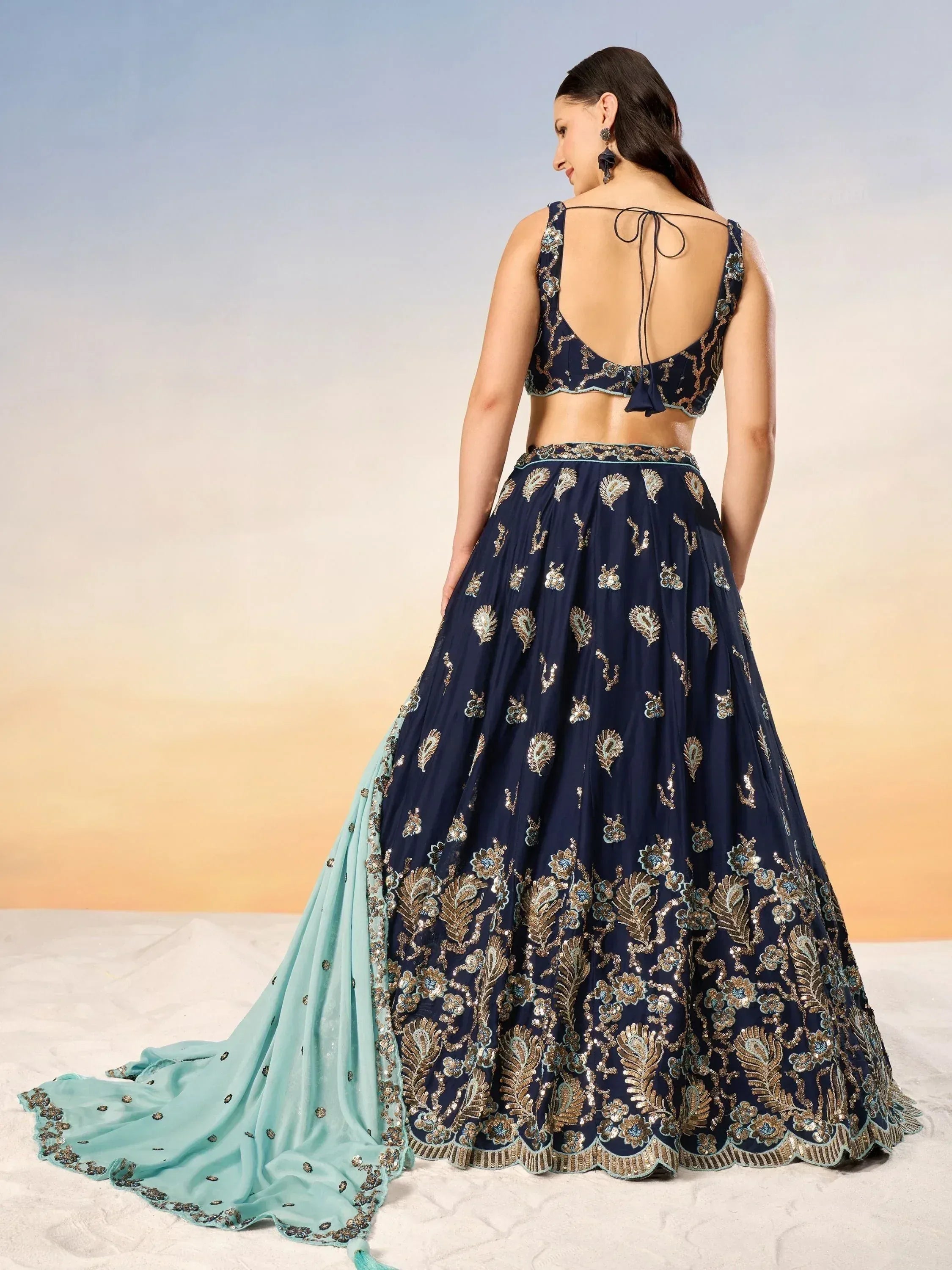 Navy blue embroidered lehenga choli with gold detailing and mint dupatta, perfect for Indian ethnic occasions