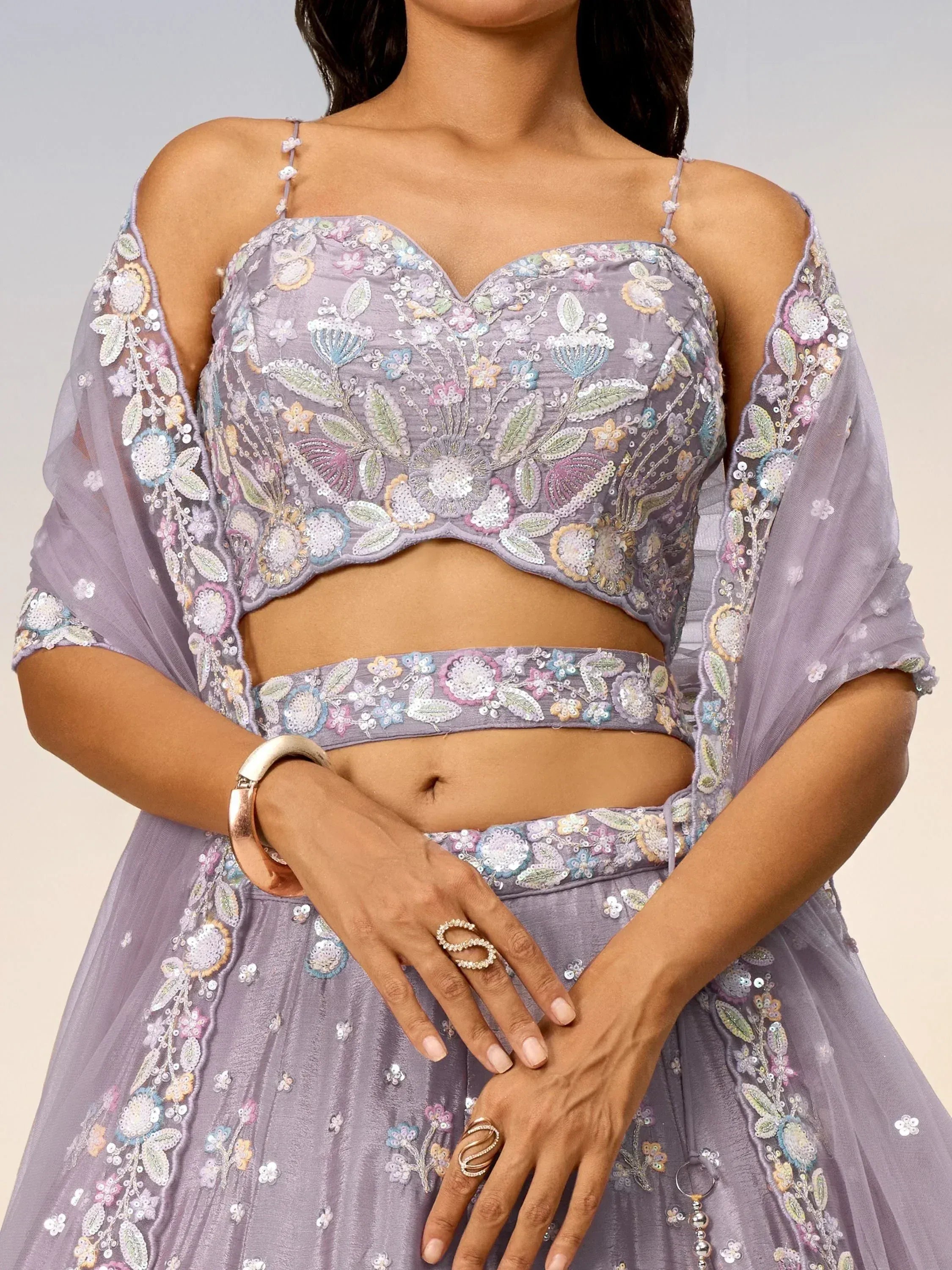 Lavender floral embroidered lehenga choli with sheer cape, perfect for Indian ethnic wear events.