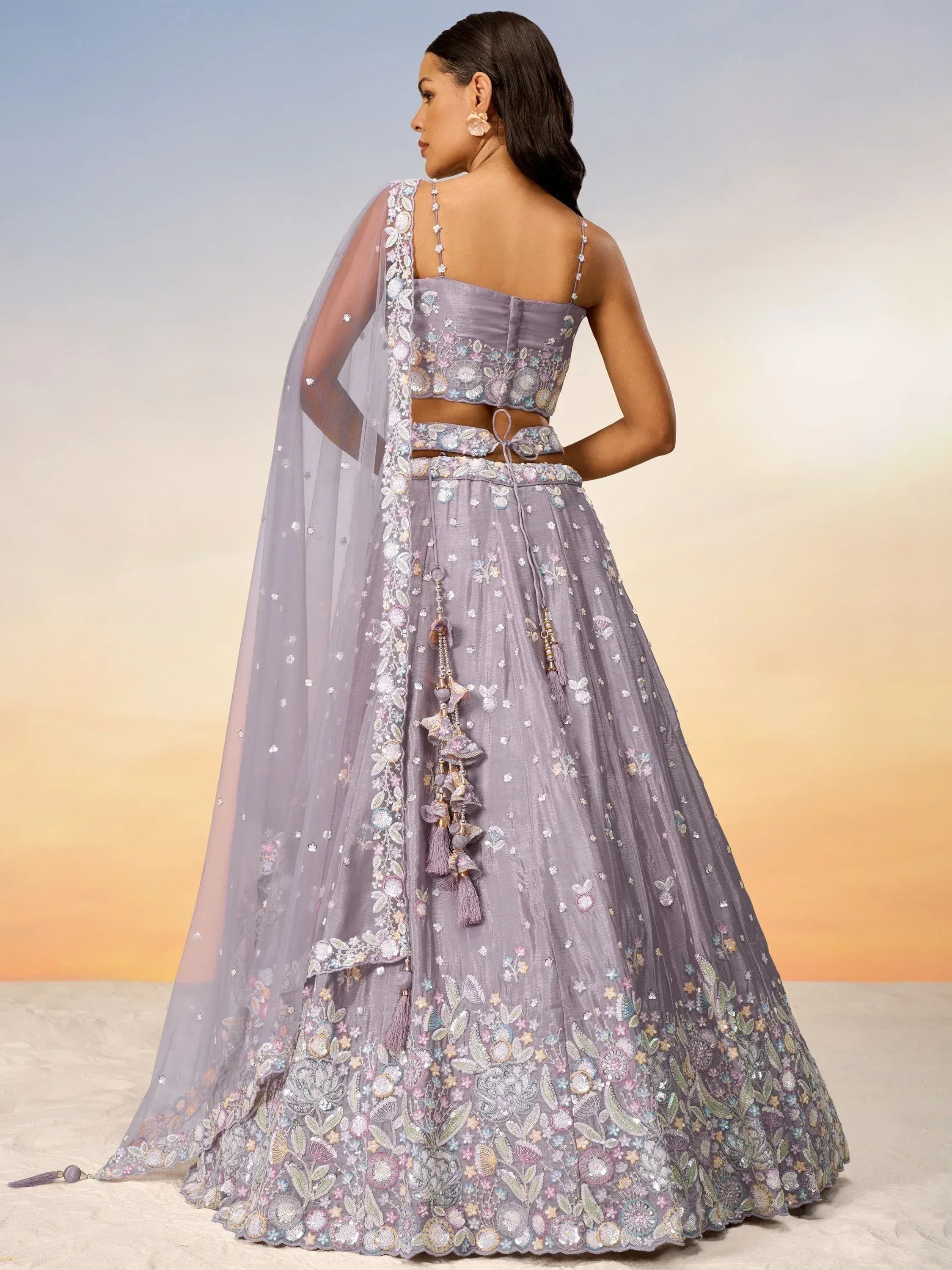 Lavender designer lehenga choli with floral embroidery and sheer dupatta, perfect for Indian ethnic wear events