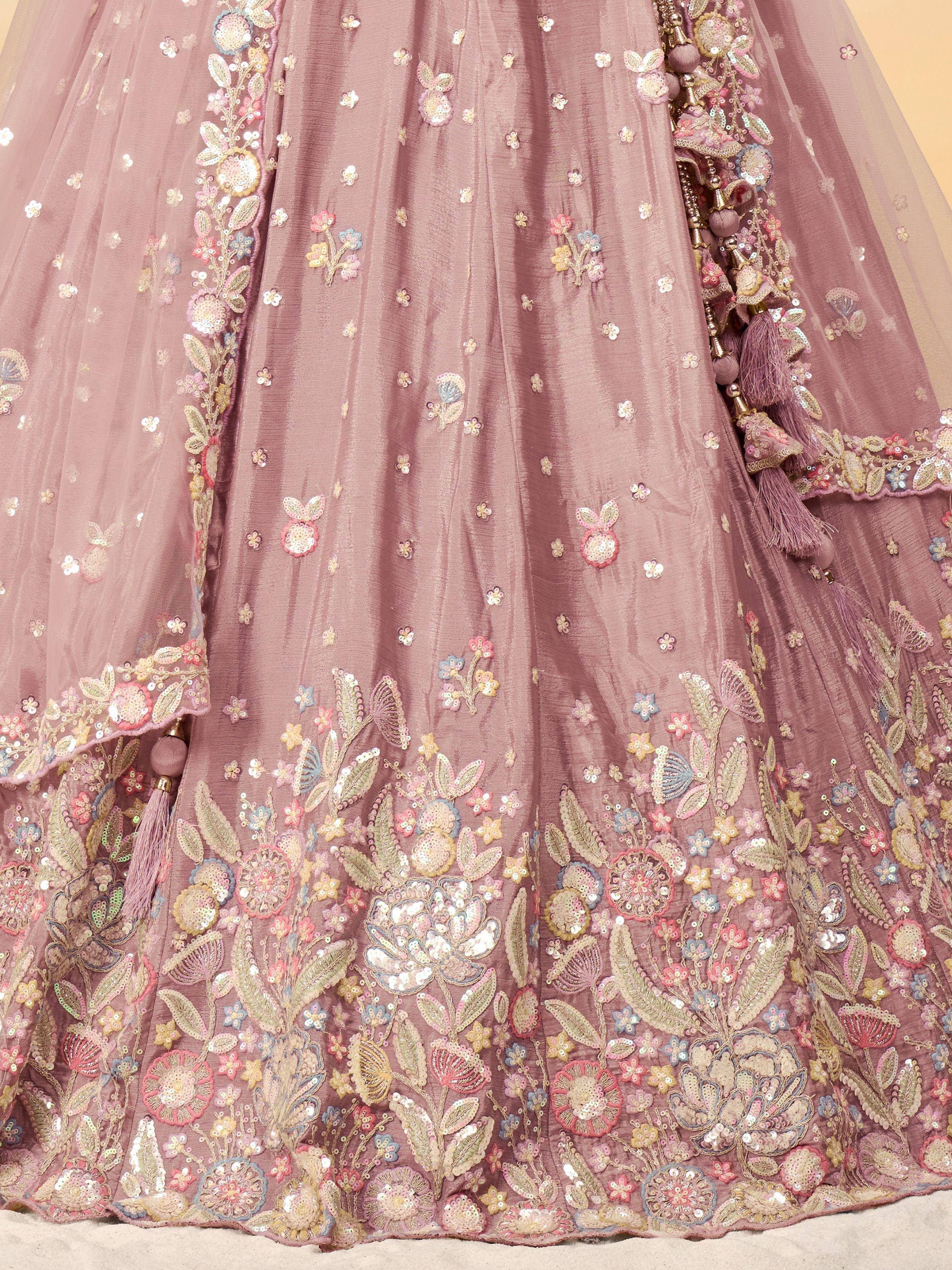 Dusty pink lehenga with floral embroidery, sequins, and tassels for Indian ethnic wear