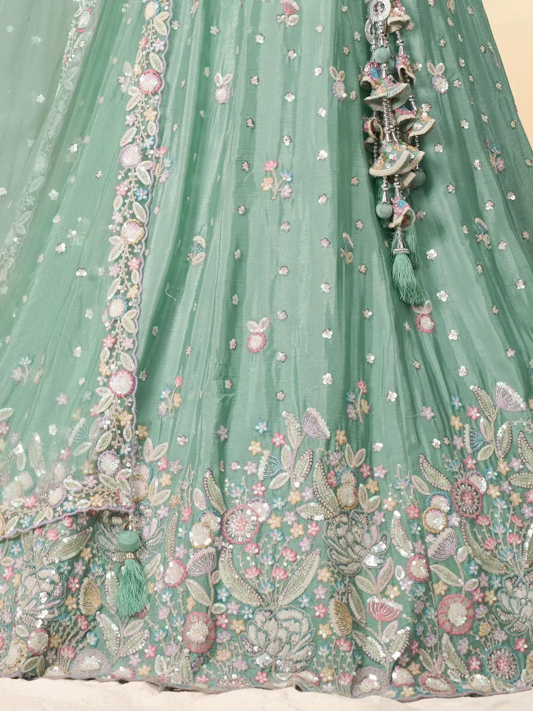 Mint green lehenga with floral embroidery, sequins, and tassels for Indian ethnic wear