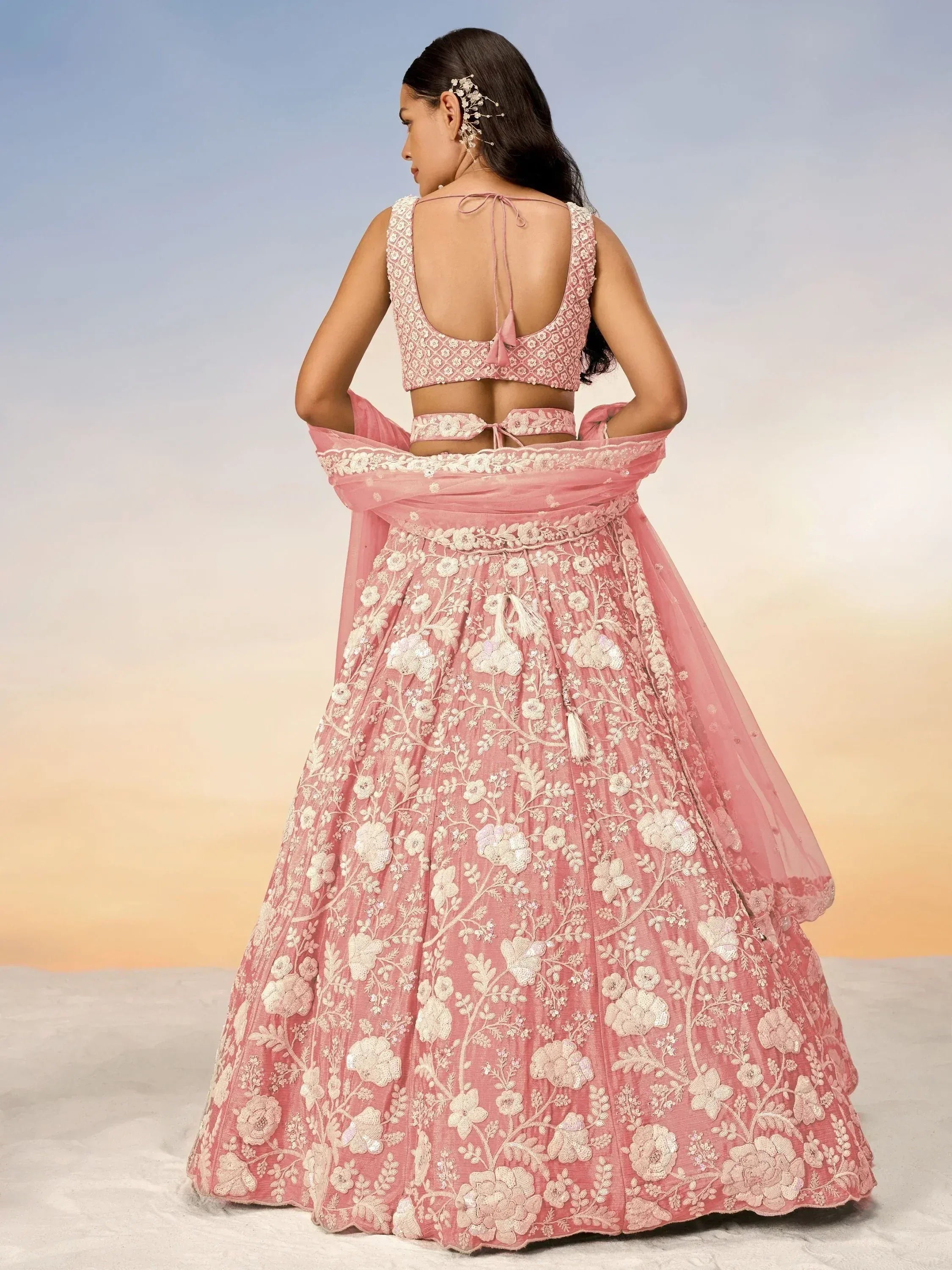 Pink floral embroidered lehenga choli with back tie blouse, perfect for Indian weddings and festive occasions.