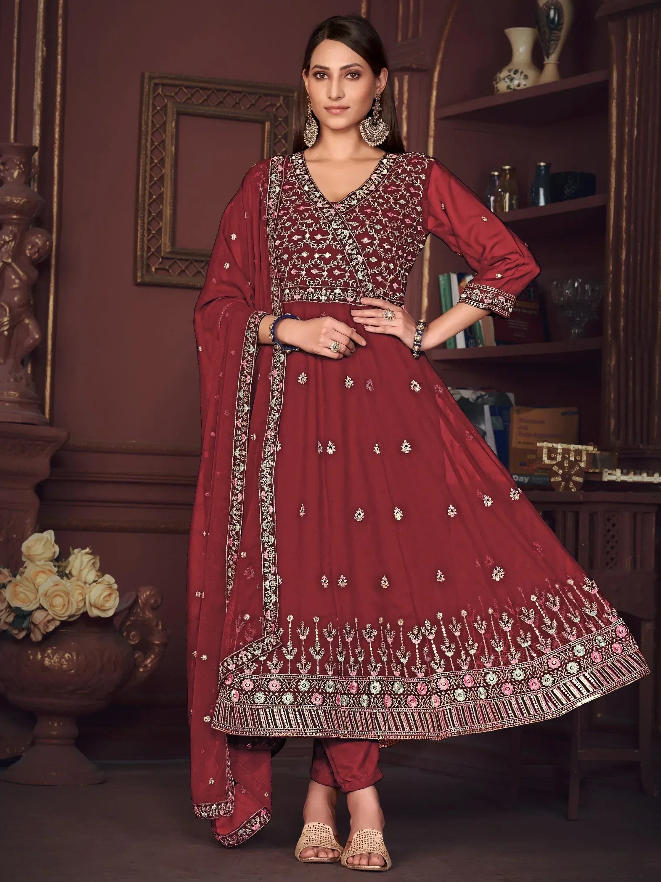 Elegant maroon ethnic anarkali suit with intricate embroidery and floral patterns