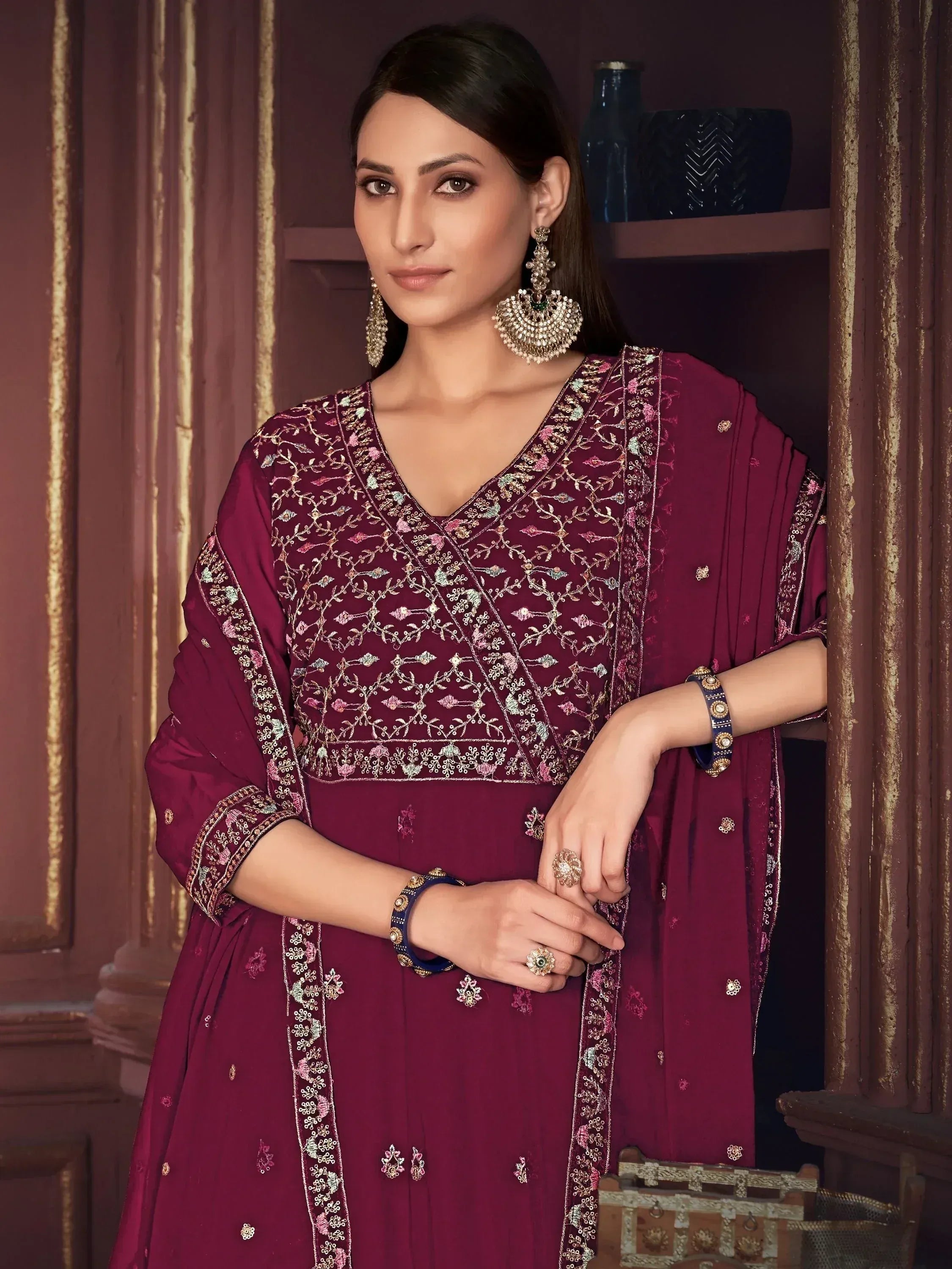 Elegant maroon embroidered salwar kameez with floral detailing, perfect for Indian ethnic wear occasions.