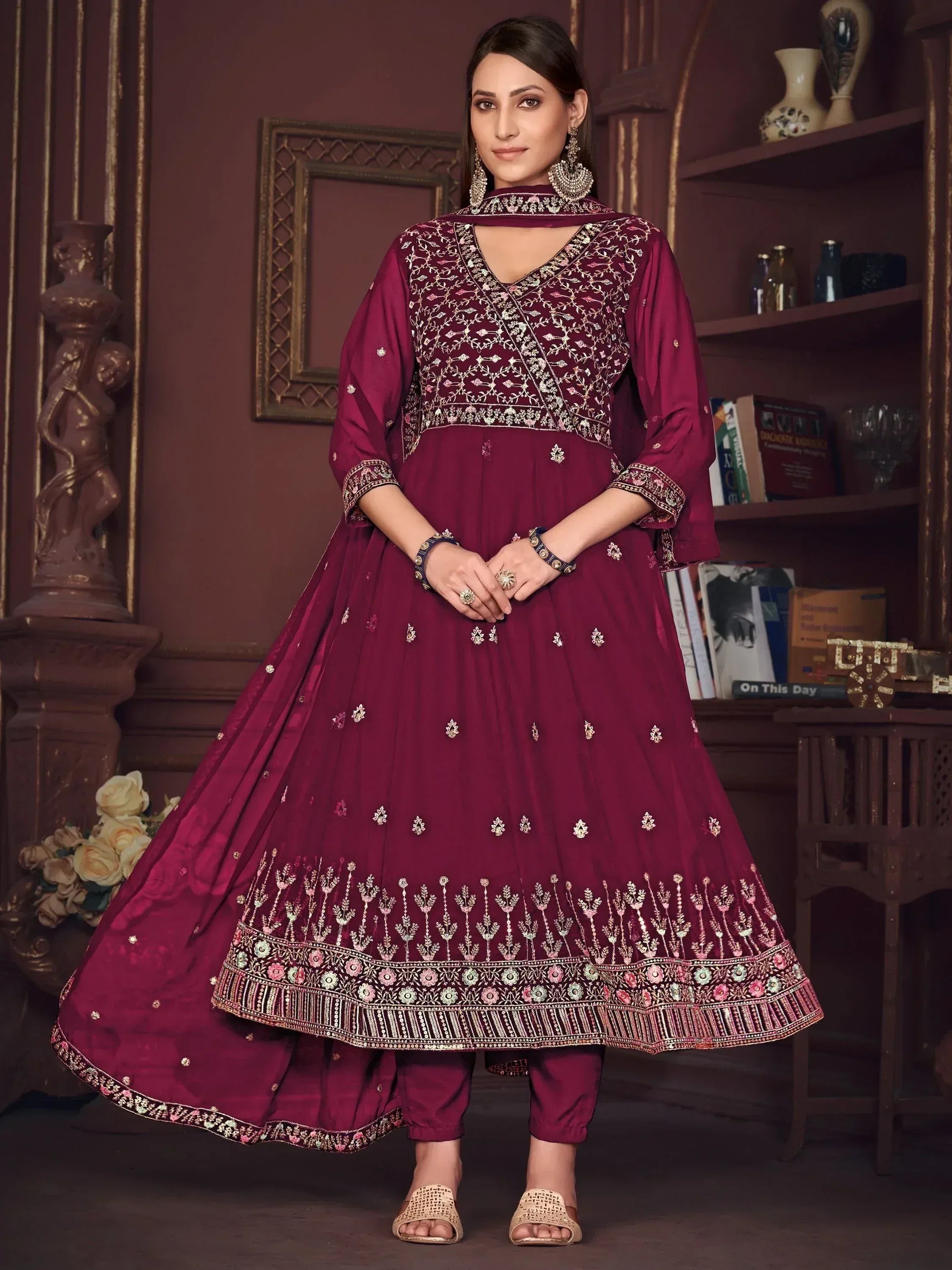 Elegant maroon anarkali suit with intricate embroidery and floral detailing, perfect for Indian ethnic wear.
