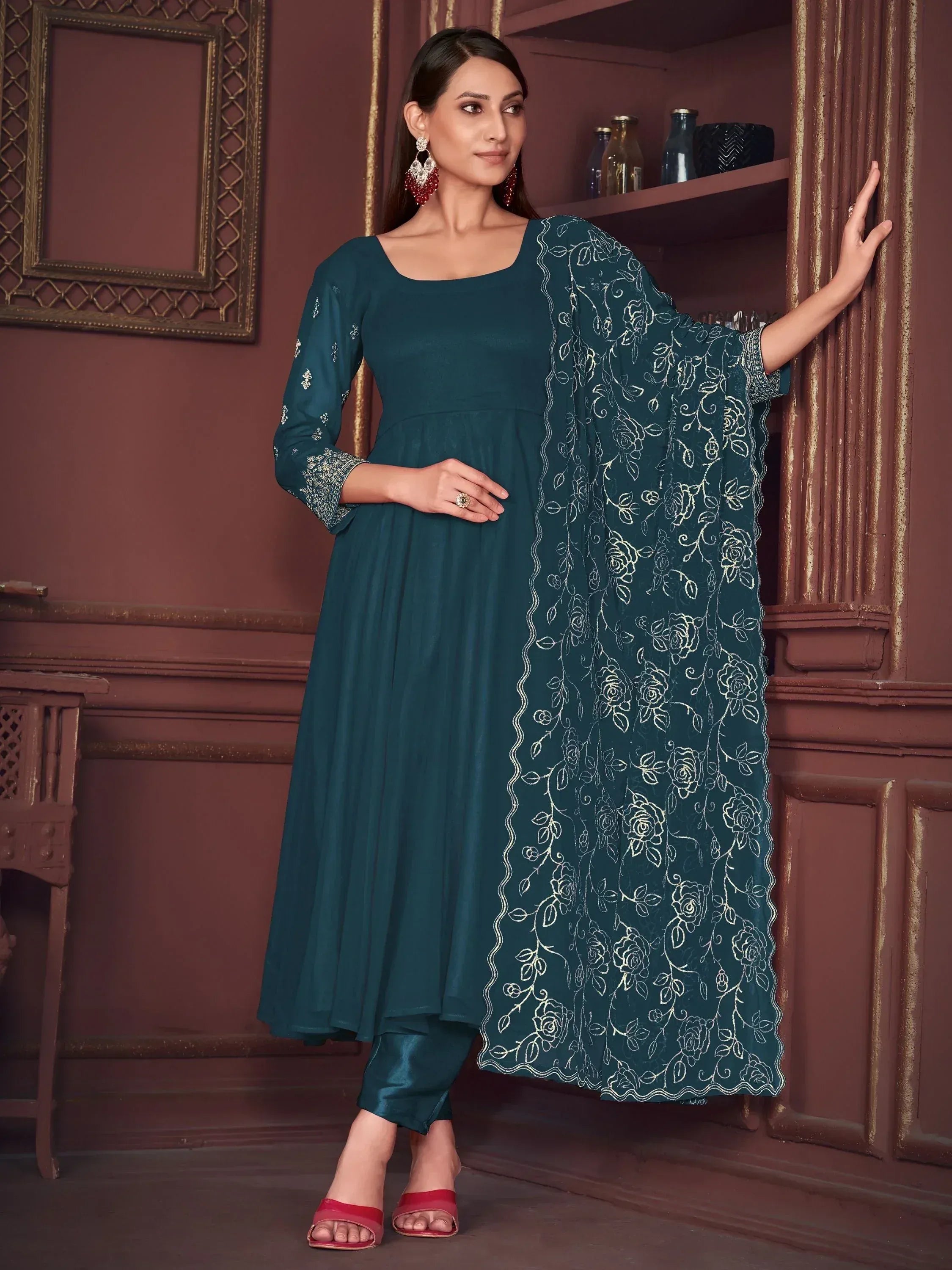 Teal ethnic salwar kameez with floral embroidery, perfect for Indian occasions and festive wear.