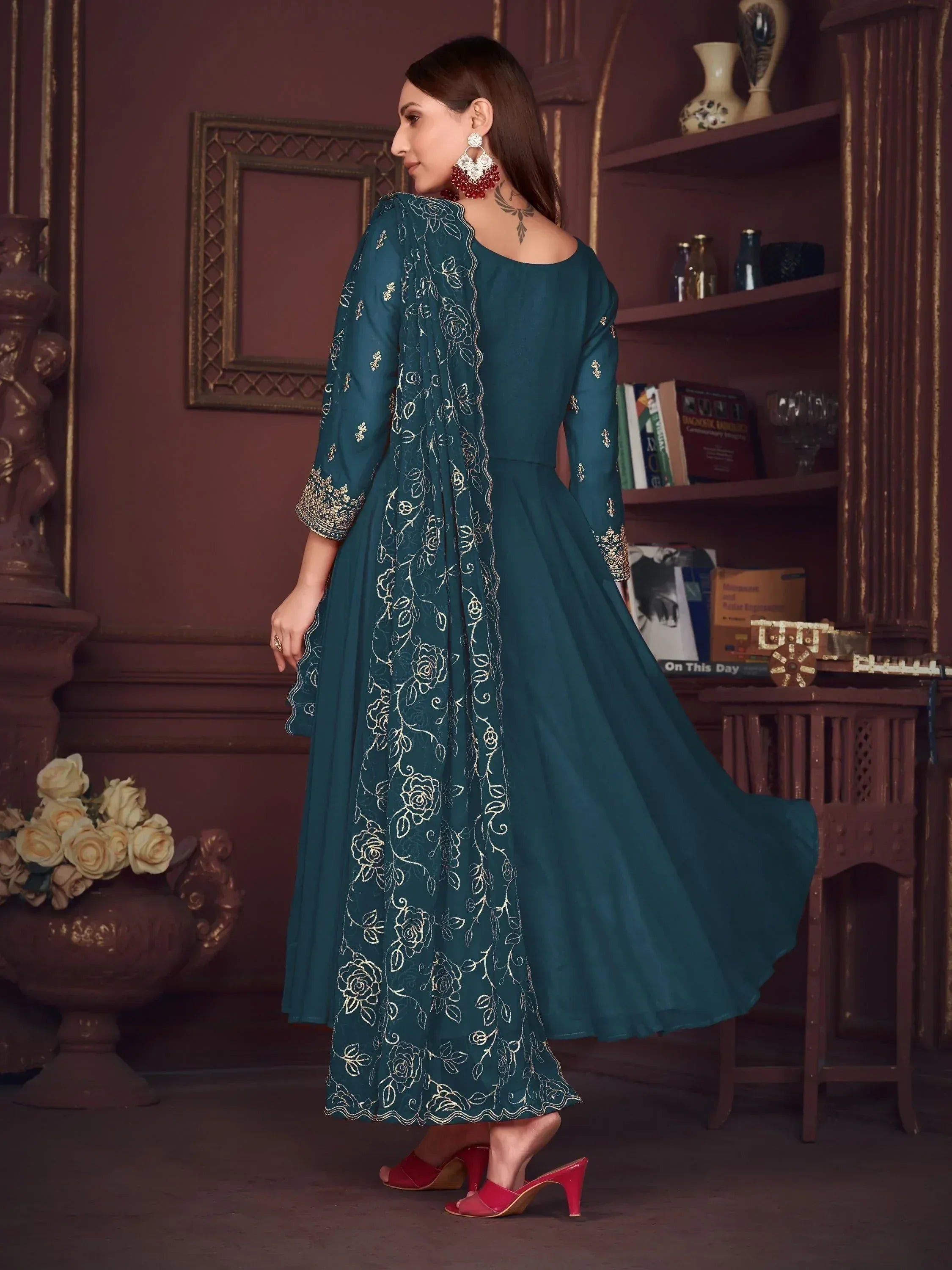 Teal embroidered anarkali gown with floral detailing, perfect for Indian ethnic wear occasions.