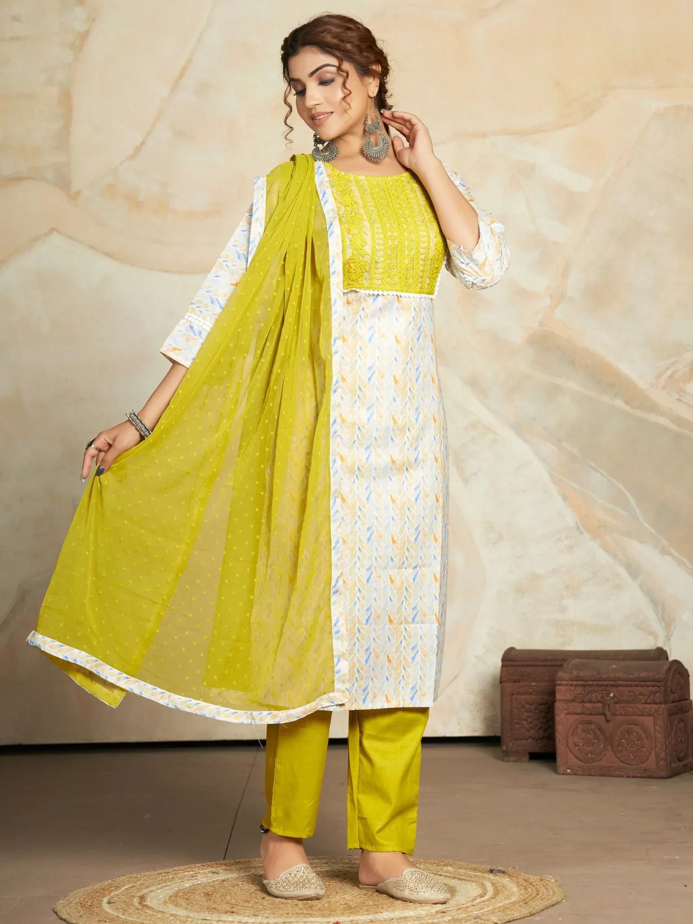 Yellow and white printed salwar kameez with matching dupatta, perfect for ethnic occasions