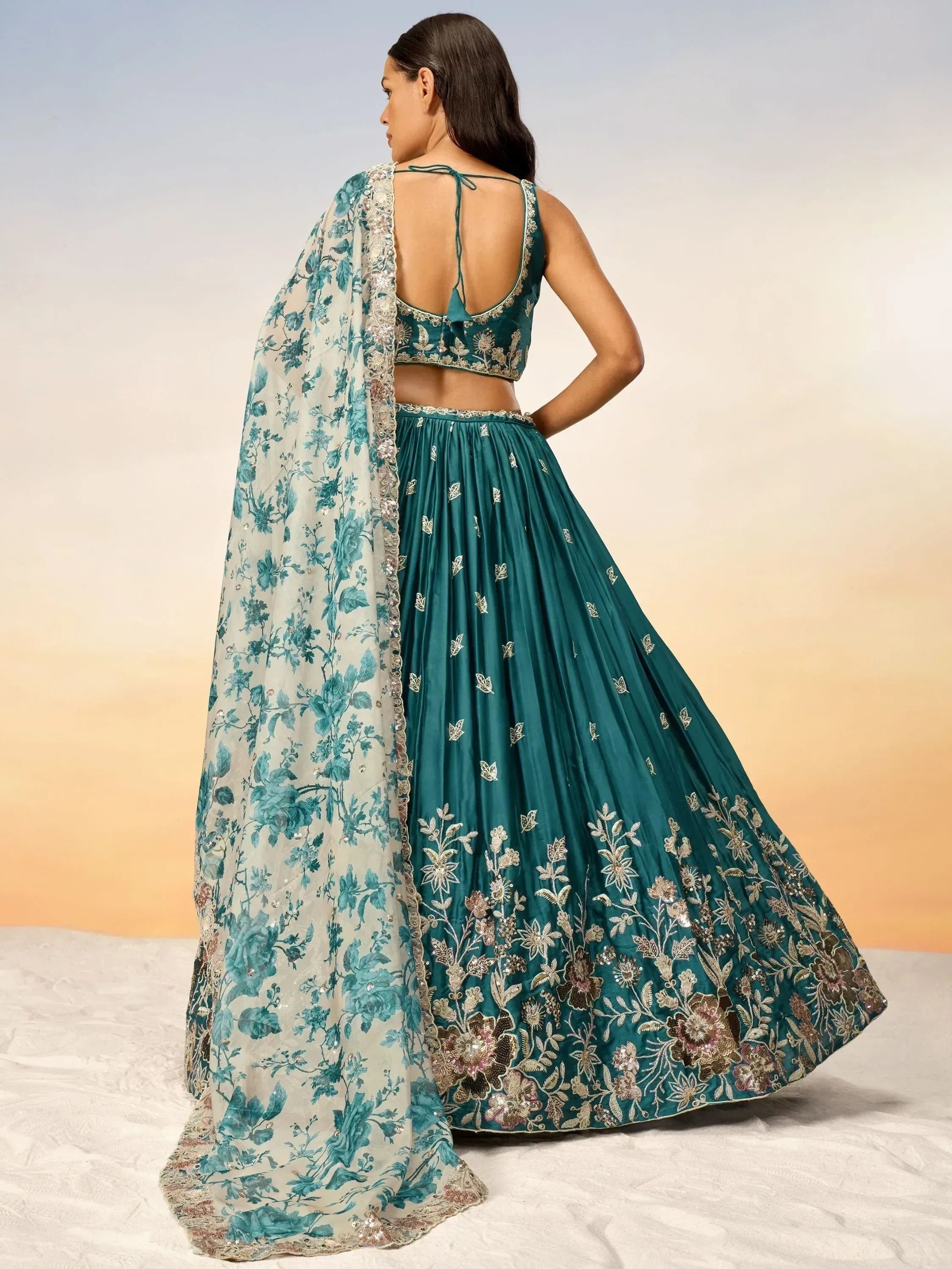 Teal designer lehenga choli with floral embroidery and matching dupatta, ethnic Indian wear