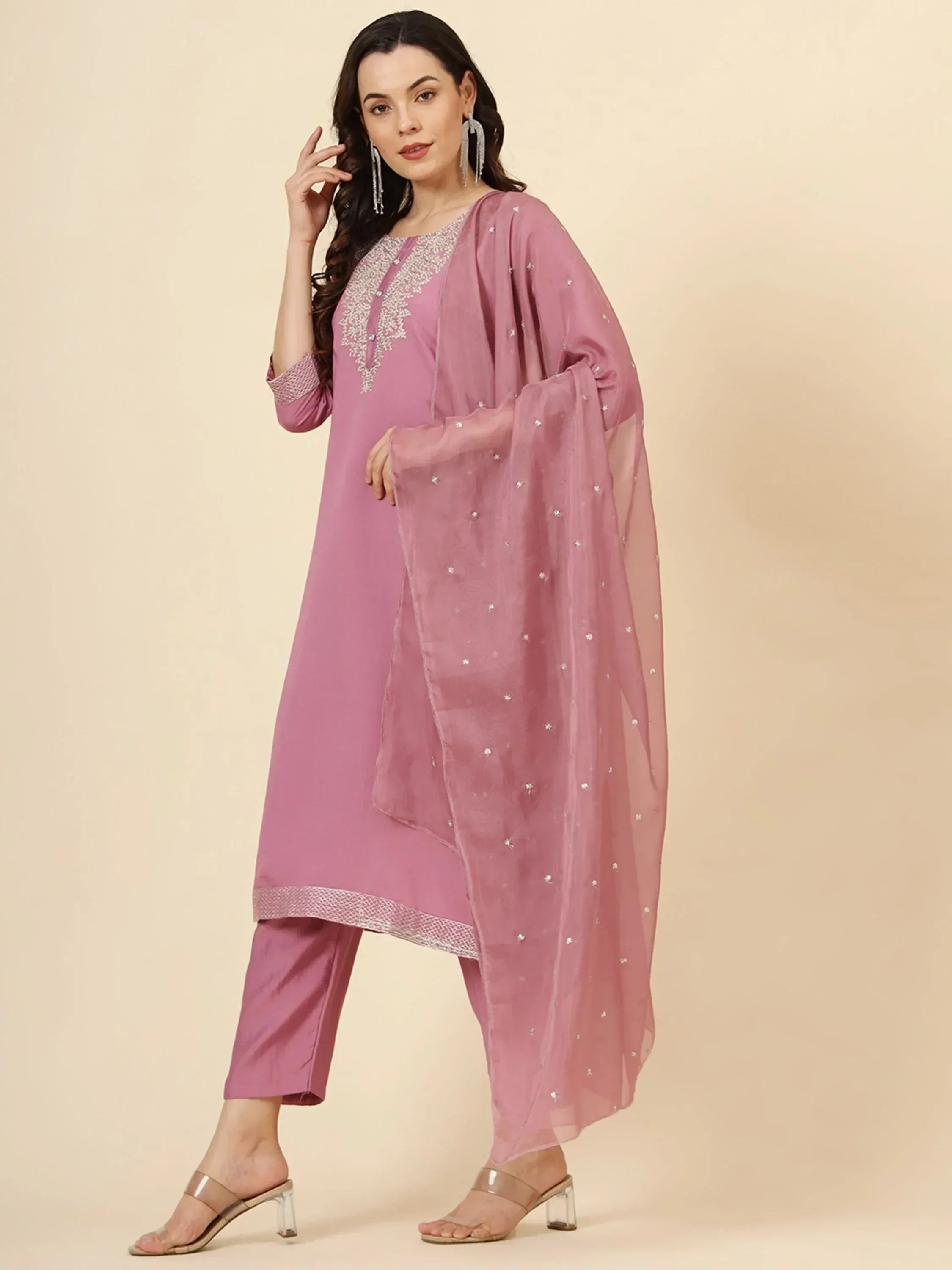 Pink embroidered salwar kameez with star-patterned dupatta, perfect for ethnic wear occasions.