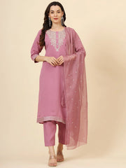 Woman wearing pink embroidered Indian salwar kameez with matching dupatta from Ethnic Plus
