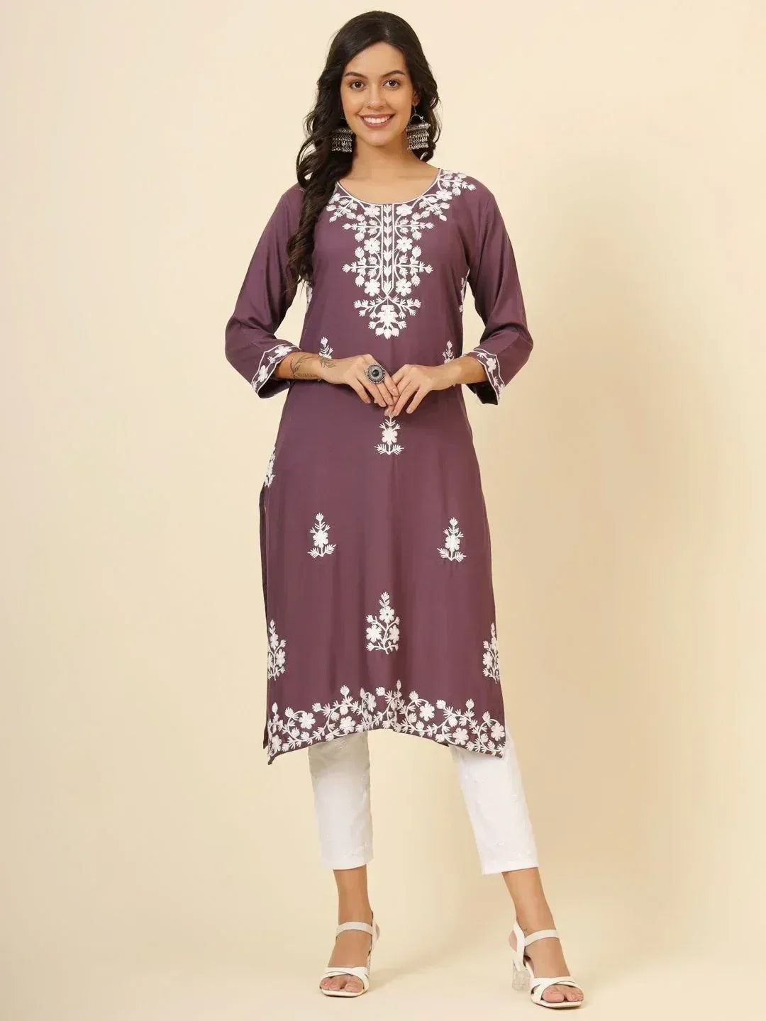 Purple ethnic kurti with white floral embroidery, paired with white pants for casual wear