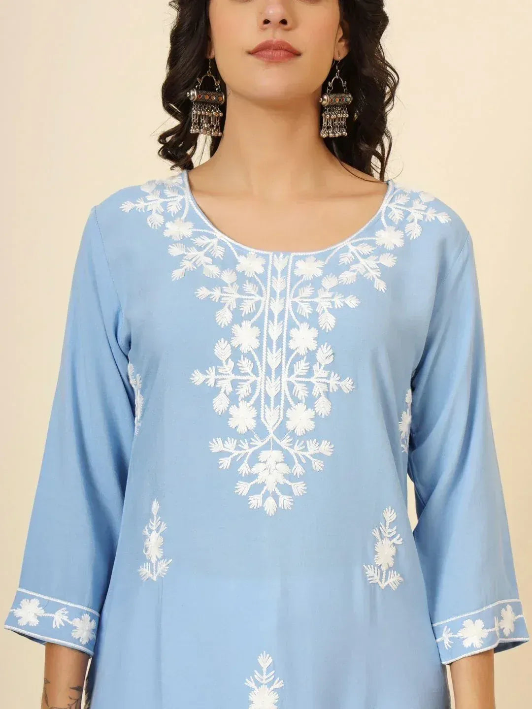 Light blue ethnic kurti with white floral embroidery and matching cuffs