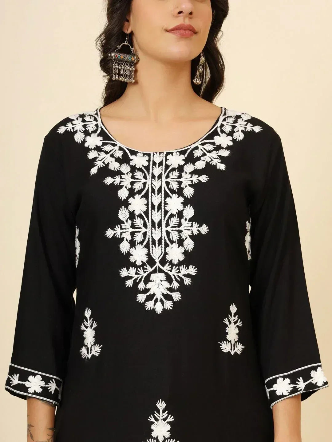 Black ethnic kurta with white floral embroidery and matching sleeve details