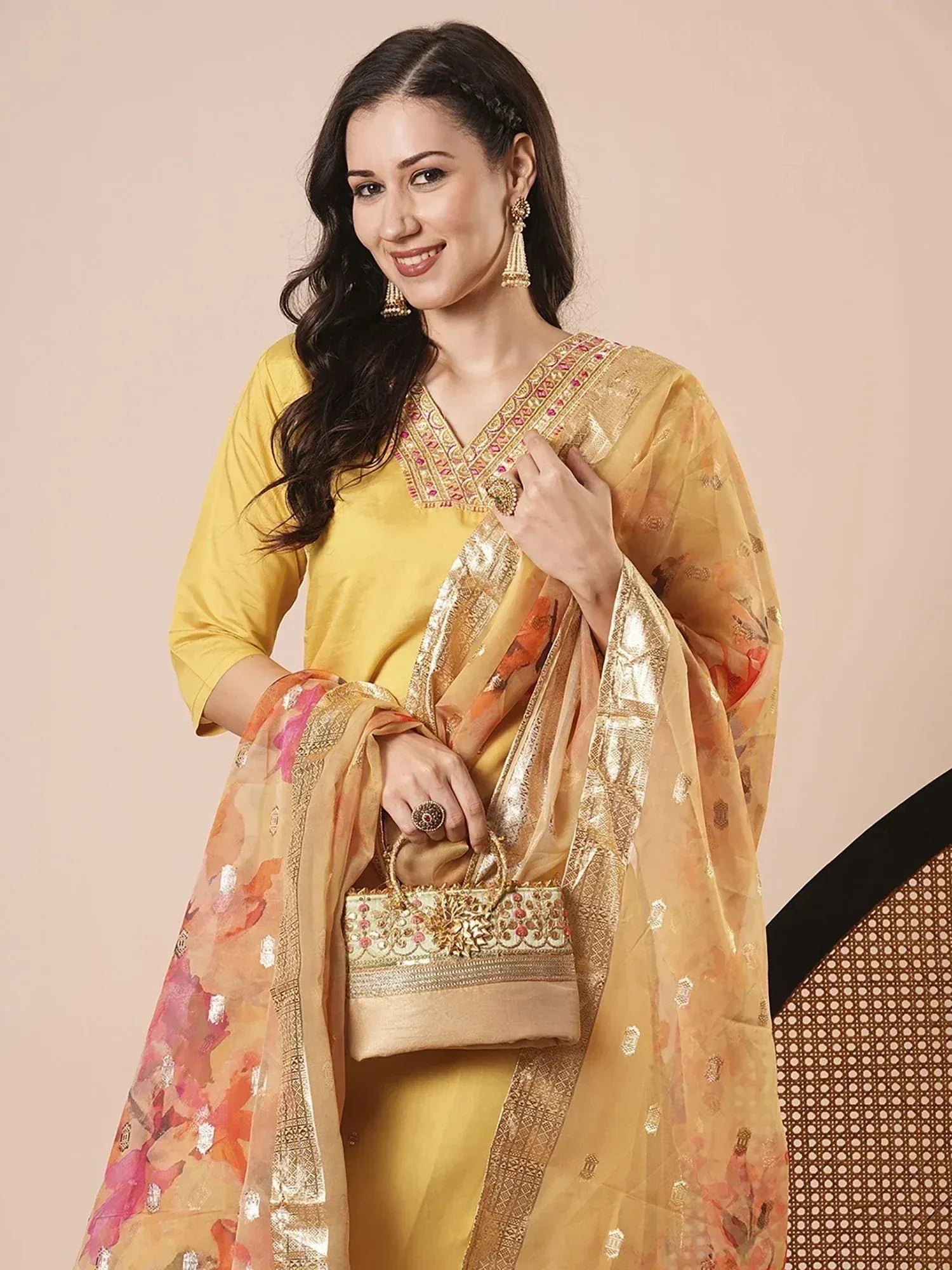 Yellow ethnic salwar kameez with floral dupatta and gold embroidery, perfect for Indian occasions