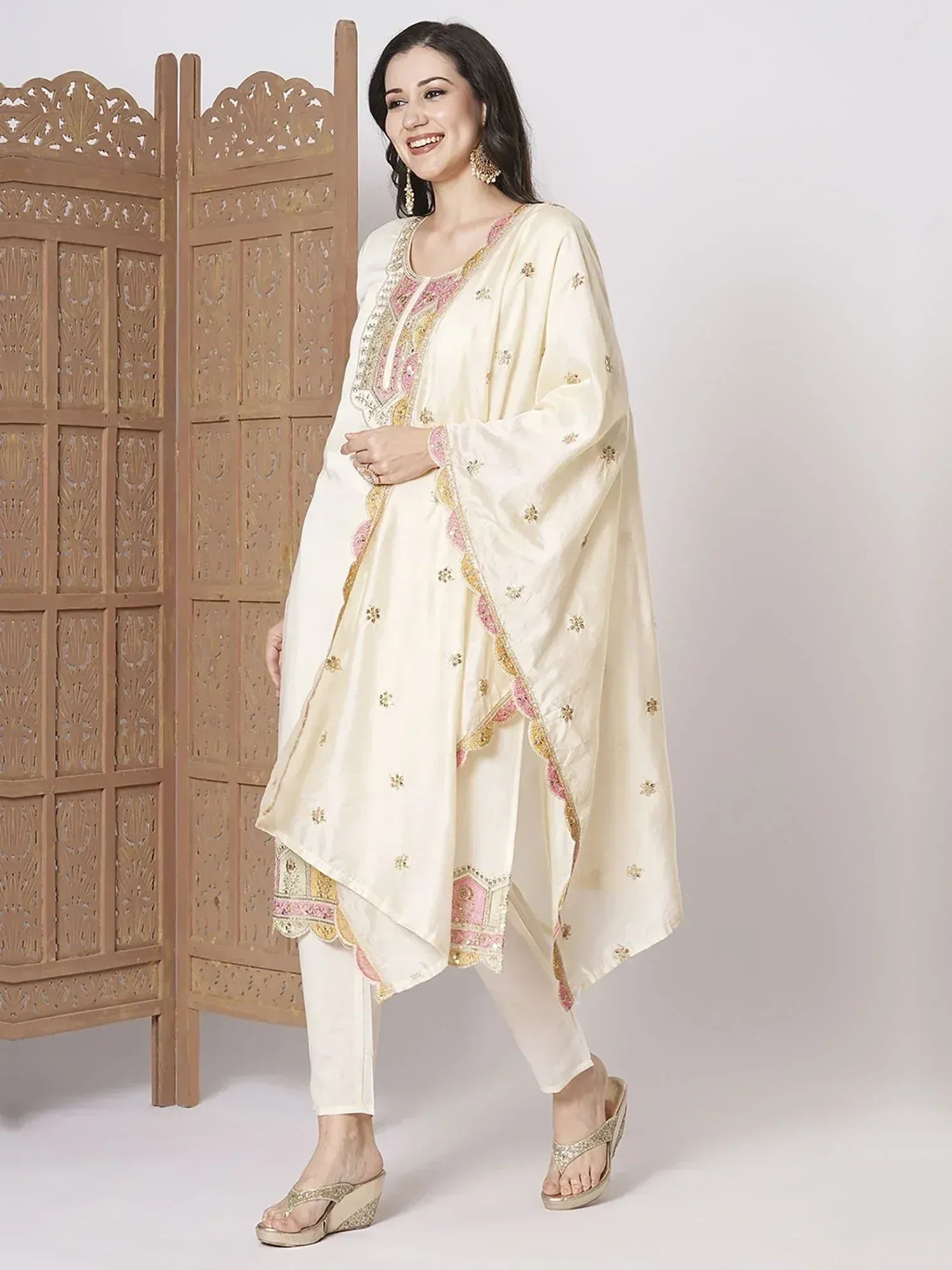 Cream embroidered salwar kameez with pink gold detailing, perfect for Indian ethnic wear occasions
