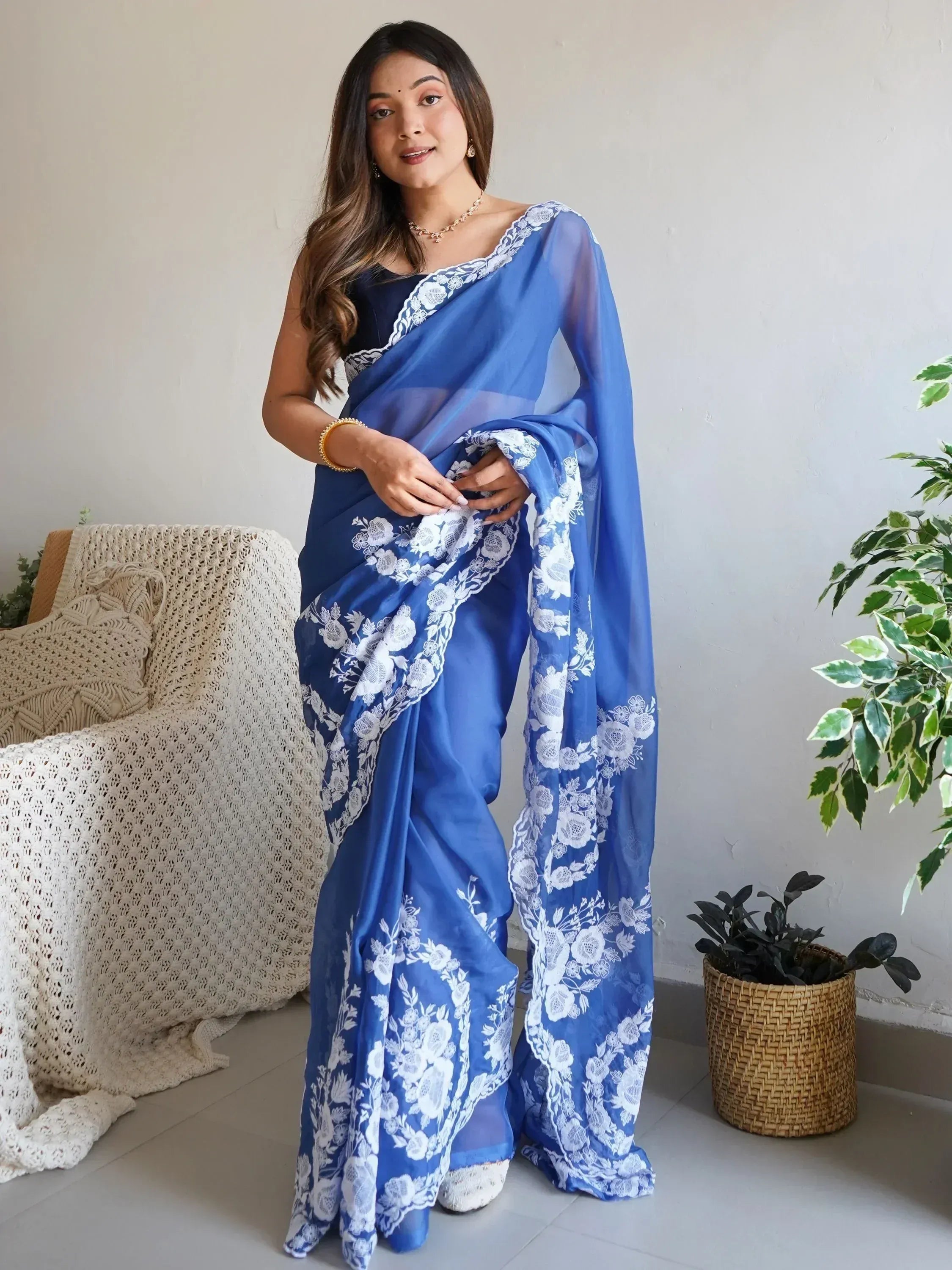 Blue floral saree with white lace detailing, perfect for ethnic occasions and Indian wear