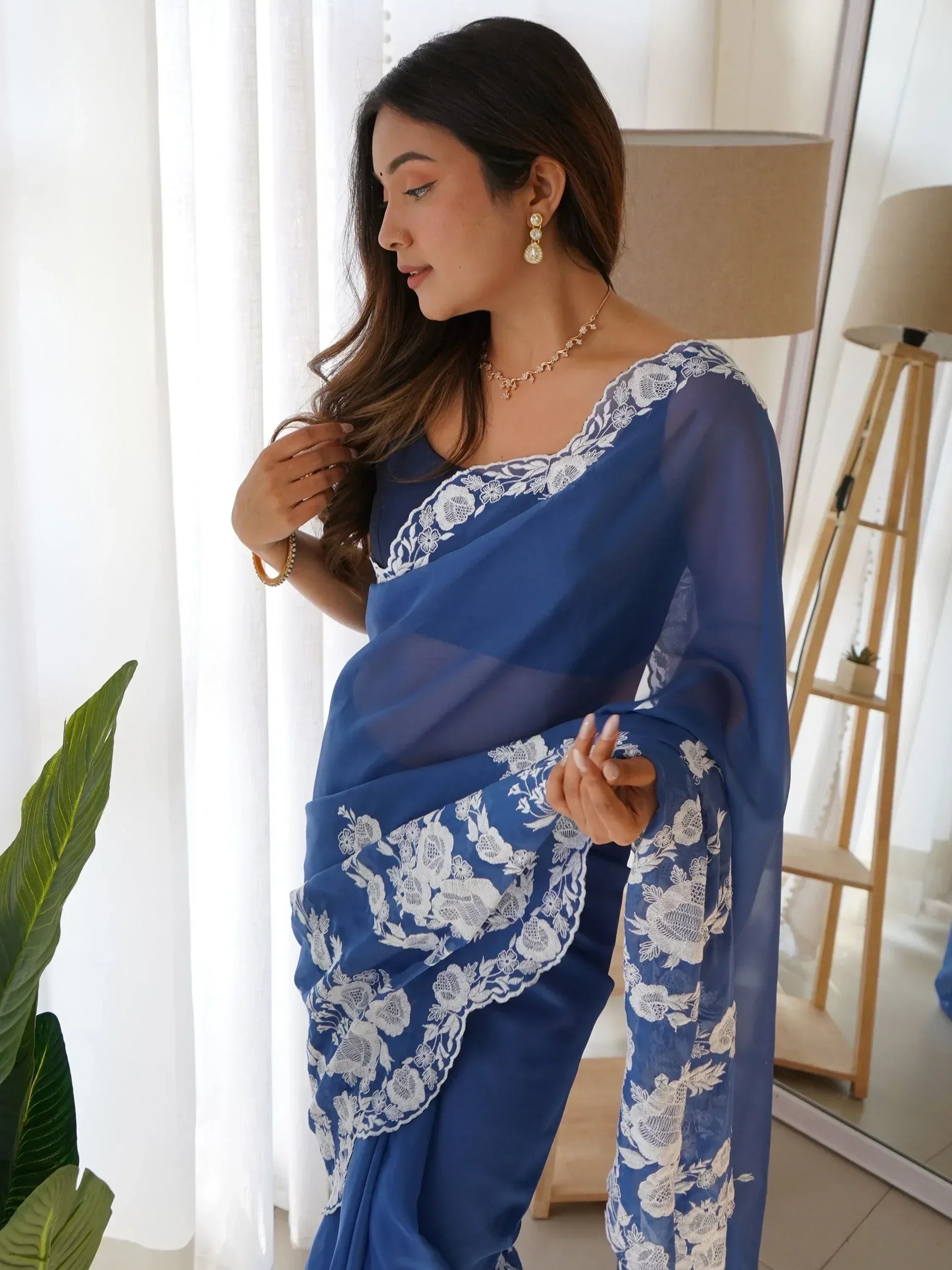 Blue saree with white floral lace detailing, elegant ethnic wear for women