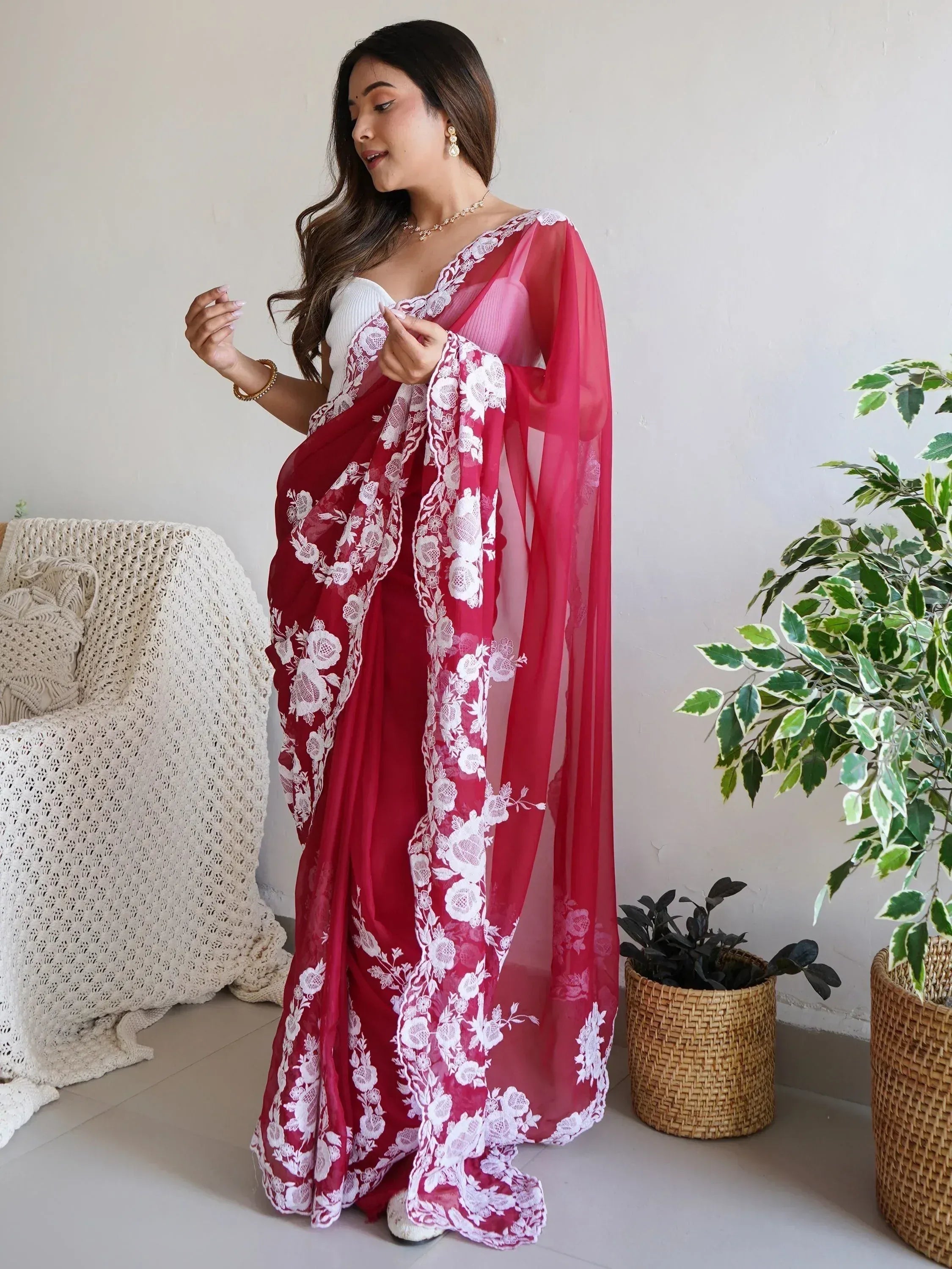 Red saree with white floral lace, styled with white blouse, perfect for Indian ethnic occasions