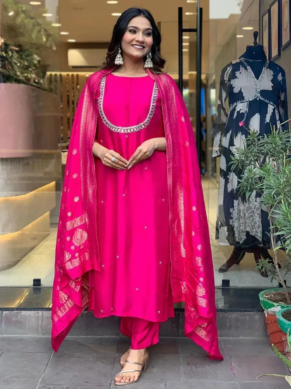 Bright pink ethnic kurta set with embroidered dupatta, perfect for Indian occasions and festive wear.