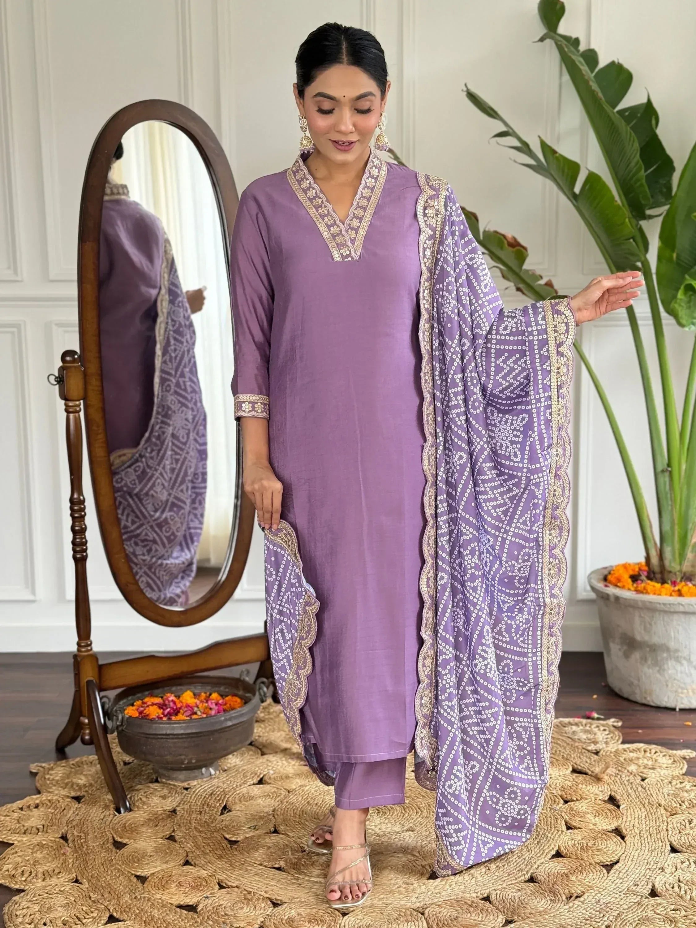 Purple ethnic salwar kameez with embroidered neckline and printed dupatta, perfect for Indian occasions