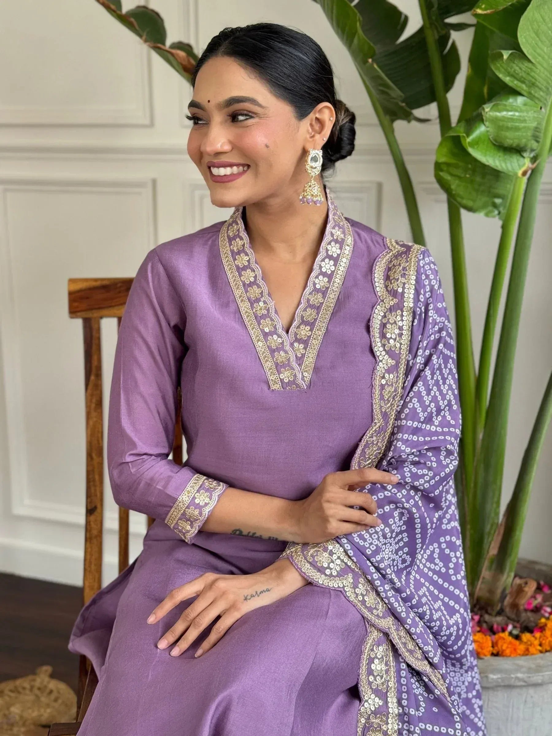 Purple embroidered salwar kameez with gold detailing, perfect for Indian ethnic wear occasions