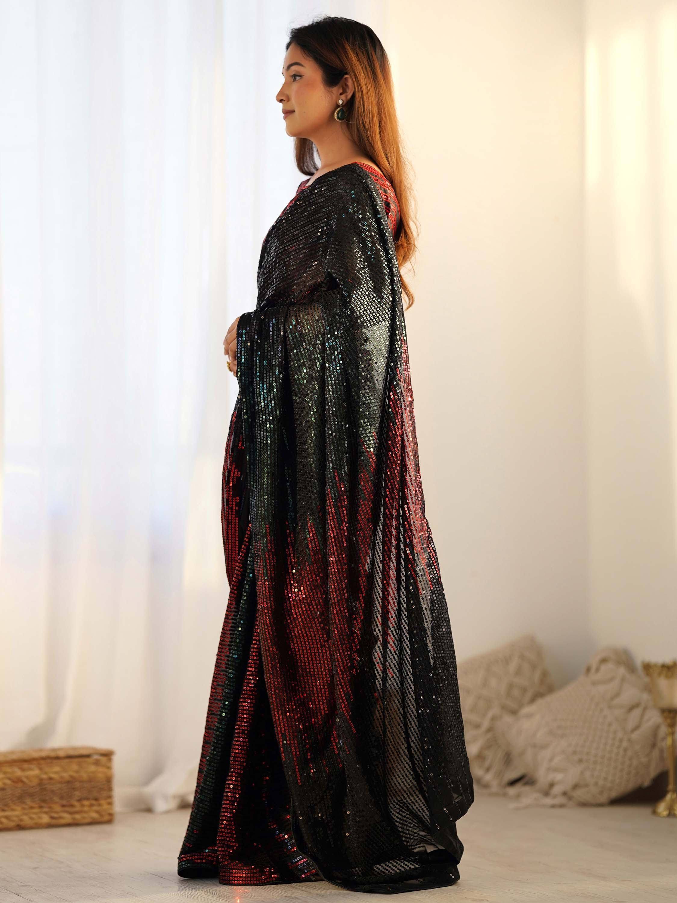 Woman in black and red sequin ethnic gown, side view, Indian festive wear
