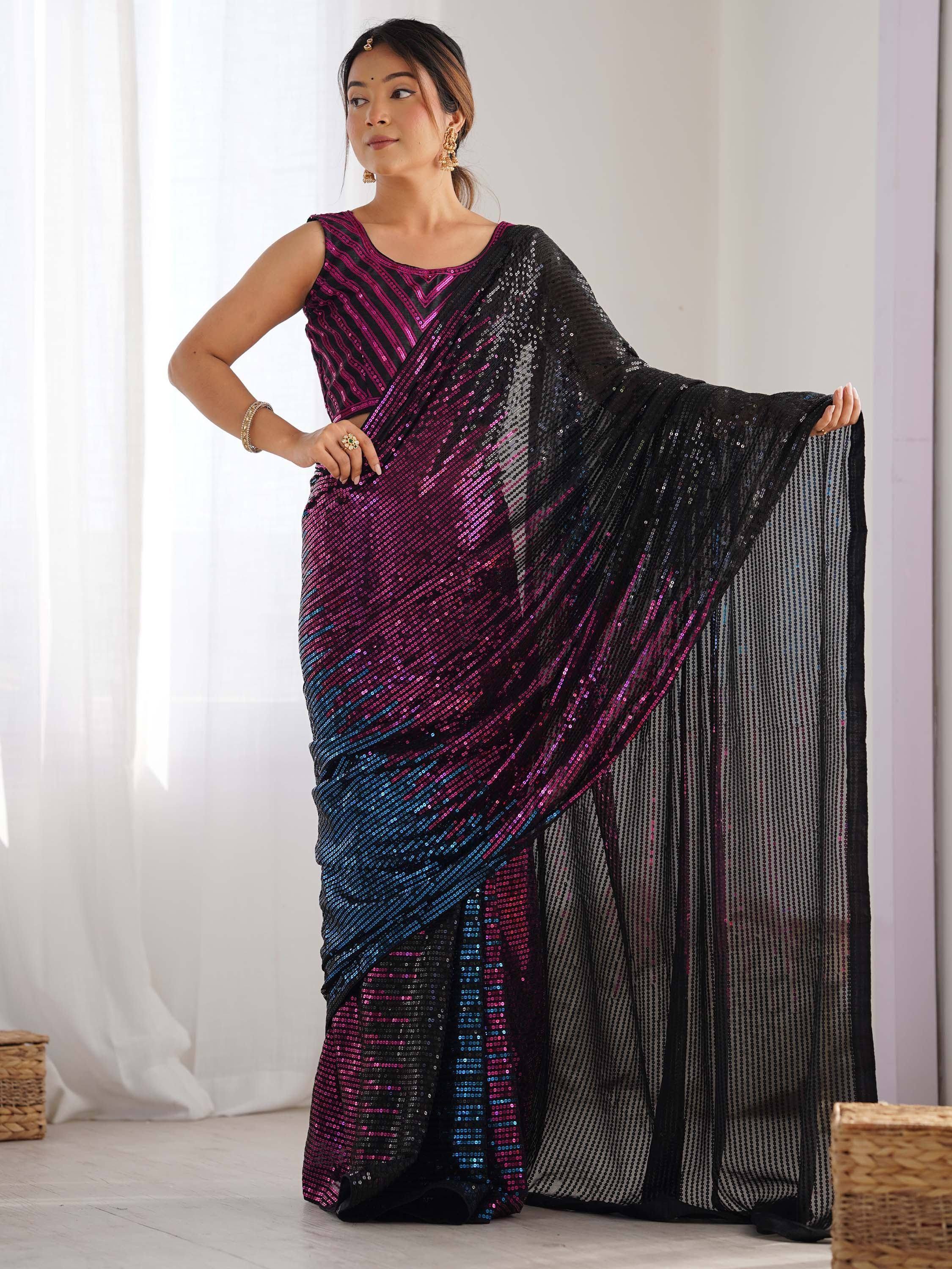 Woman in shimmering pink and blue sequin saree with black sheer pallu, styled for festive occasions