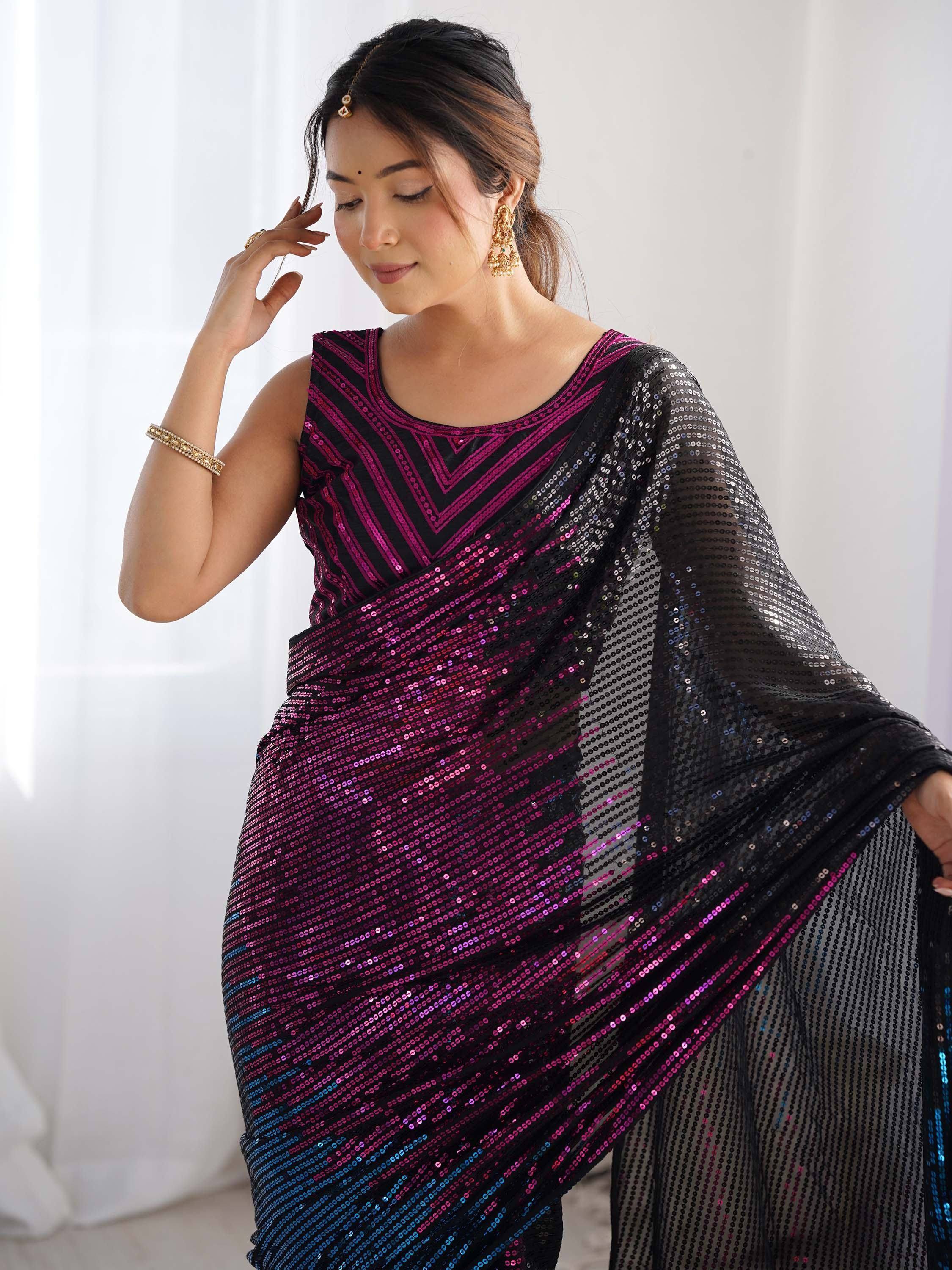 Black and pink sequin saree with geometric pattern, styled with gold jewelry for ethnic occasions