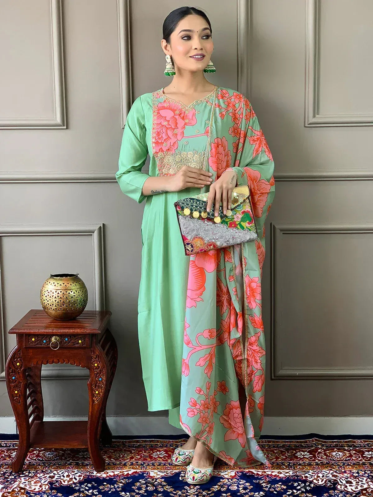 Mint green salwar kameez with pink floral print, gold embroidery, and matching dupatta for ethnic wear