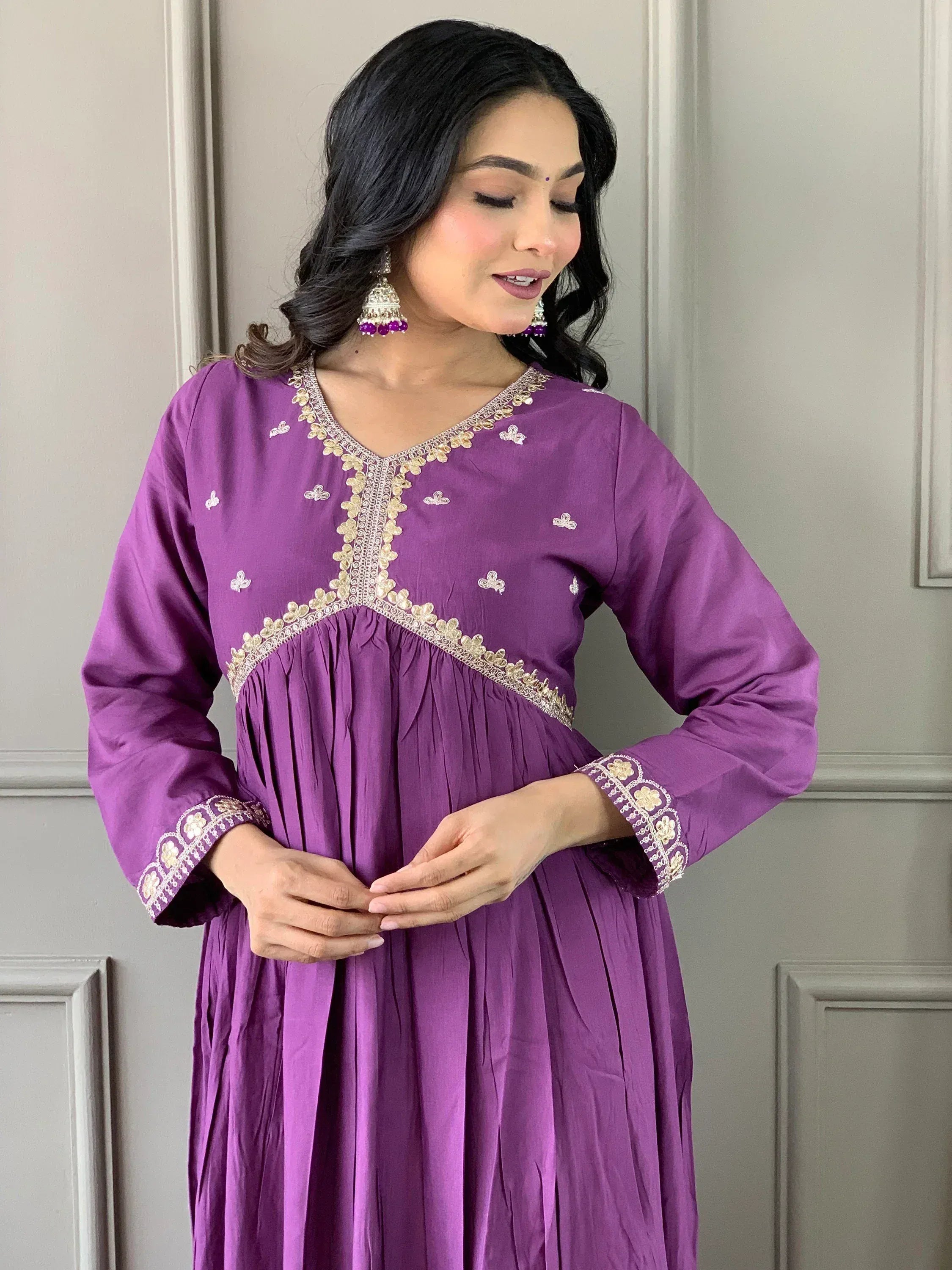 Purple ethnic gown with gold embroidery, perfect for Indian occasions and festive wear