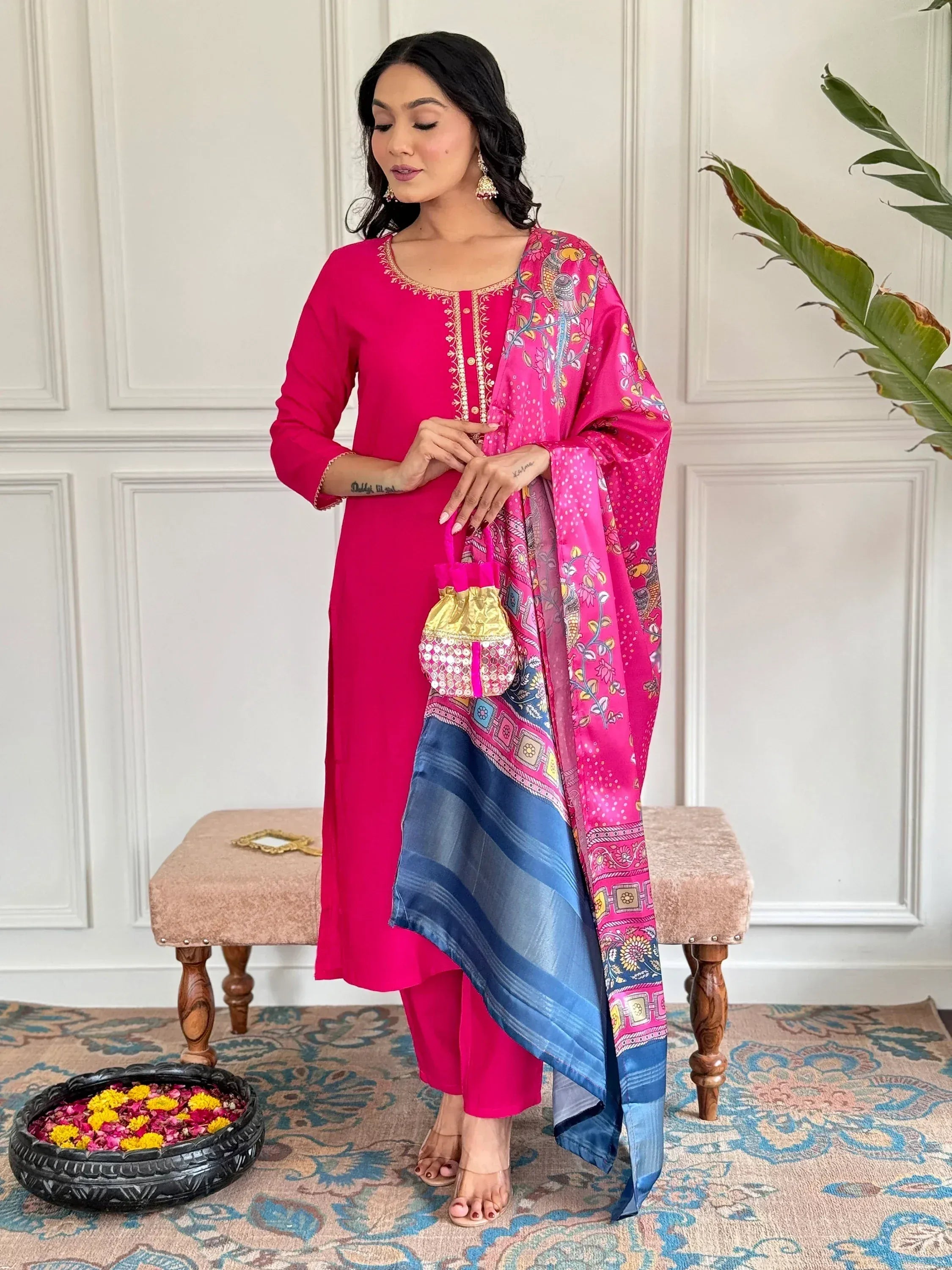 Pink ethnic salwar kameez with floral dupatta and gold embroidery, perfect for festive occasions