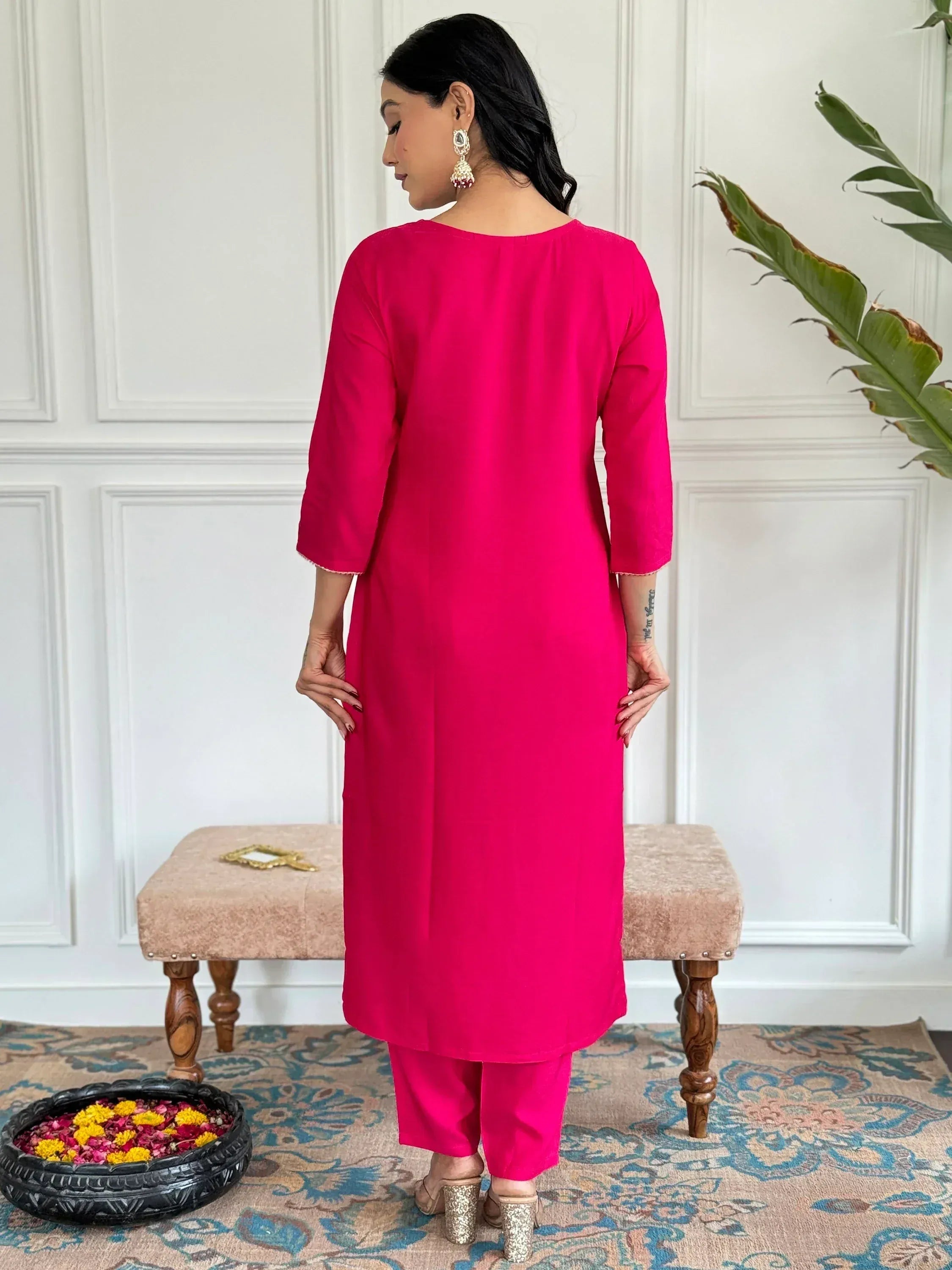 Woman in vibrant pink Indian kurta and matching pants, ethnic wear for women