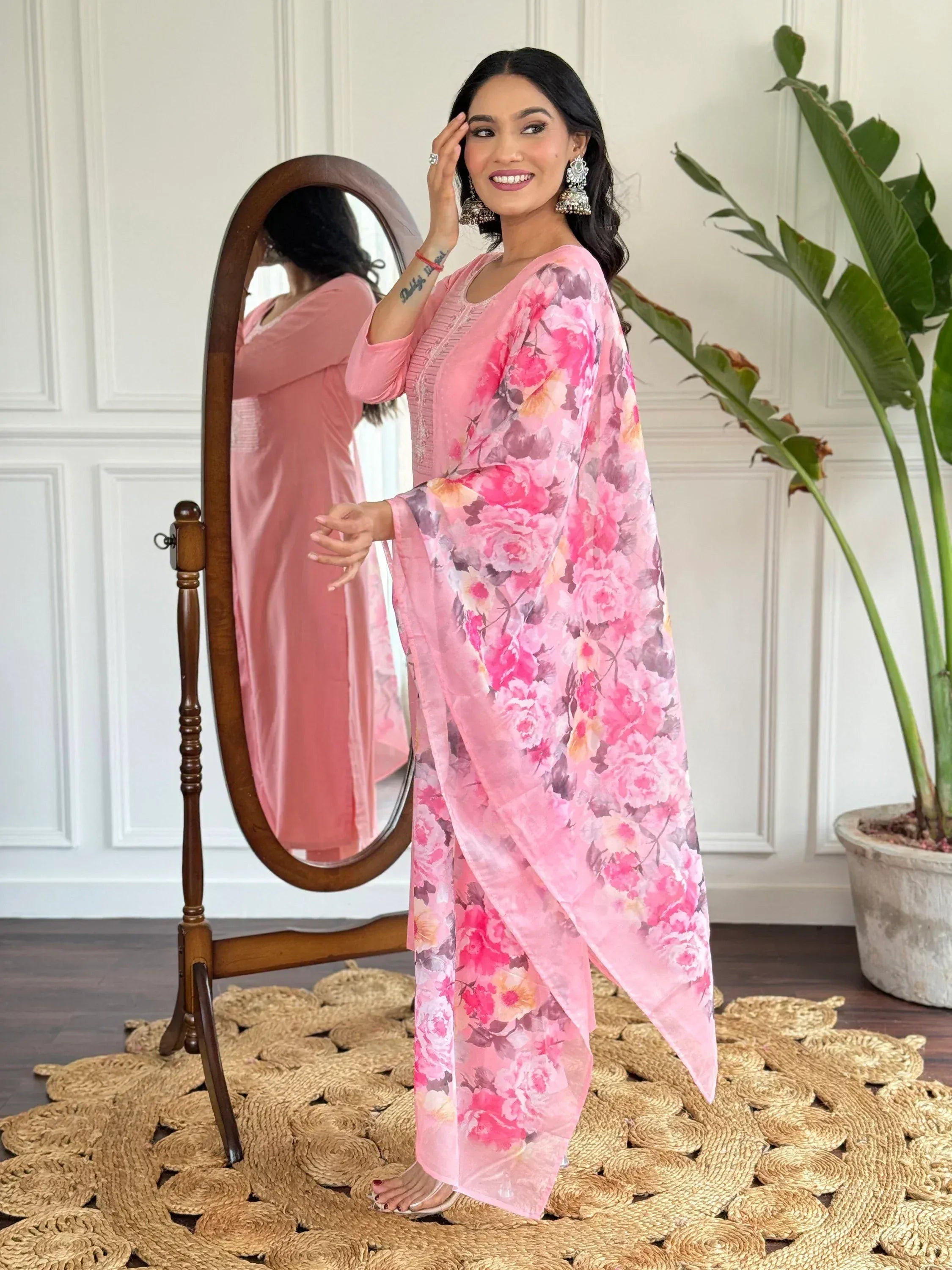 Pink floral printed ethnic kurta with matching dupatta, styled with jhumka earrings for Indian wear