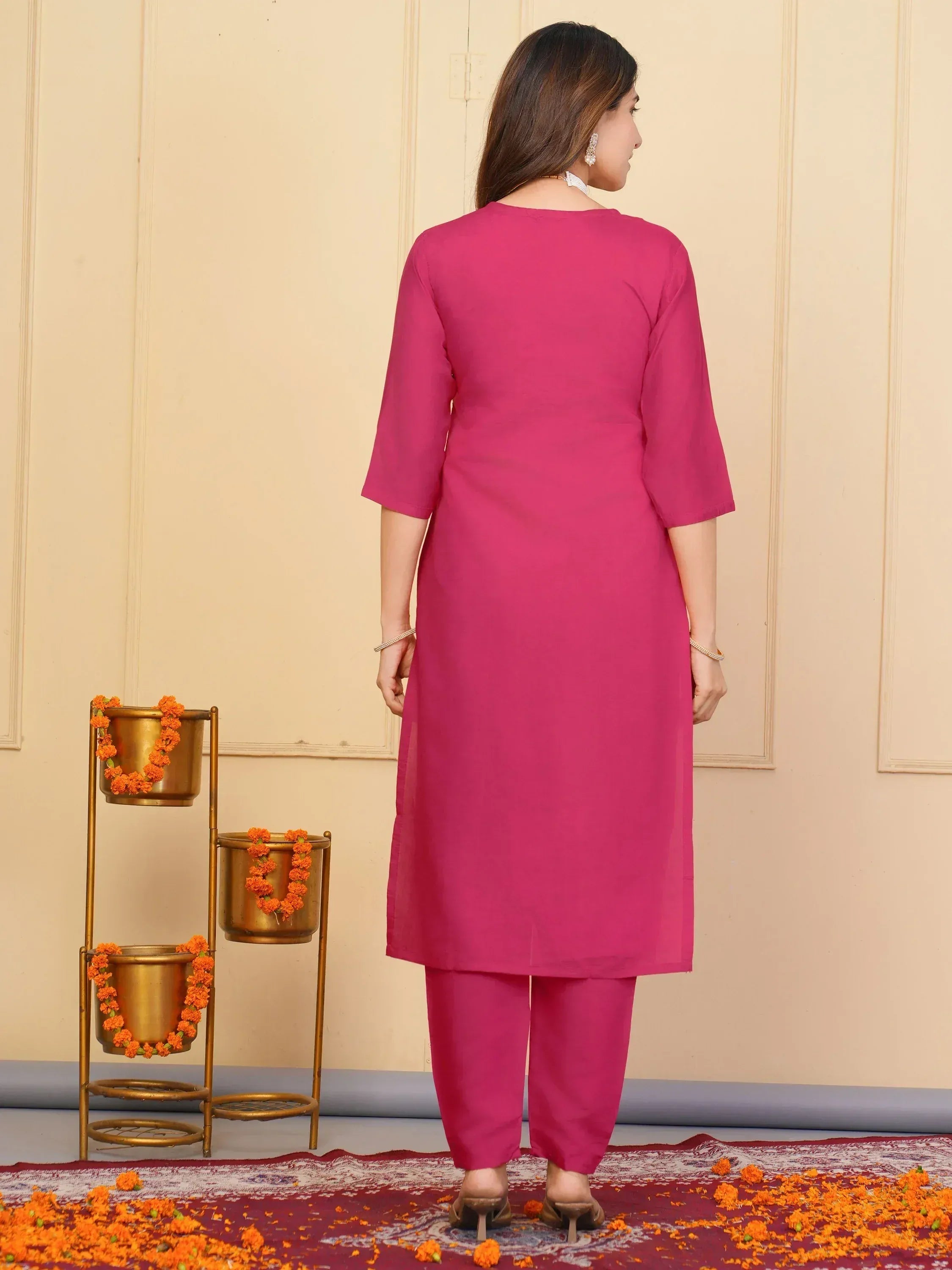 Pink Indian ethnic kurta set with matching pants, styled for festive occasions