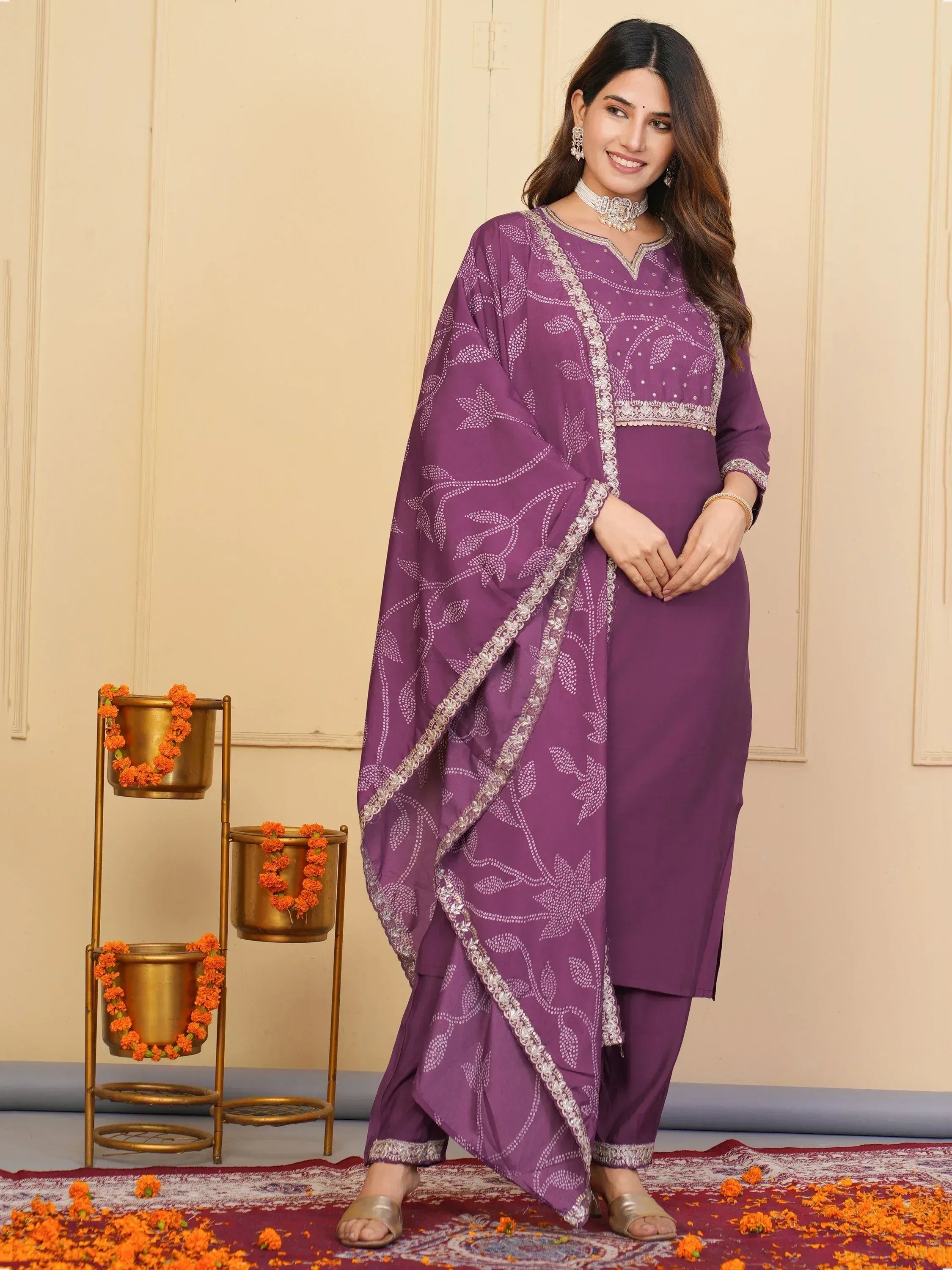 Purple ethnic salwar kameez with white floral print and silver embroidery, perfect for festive occasions.