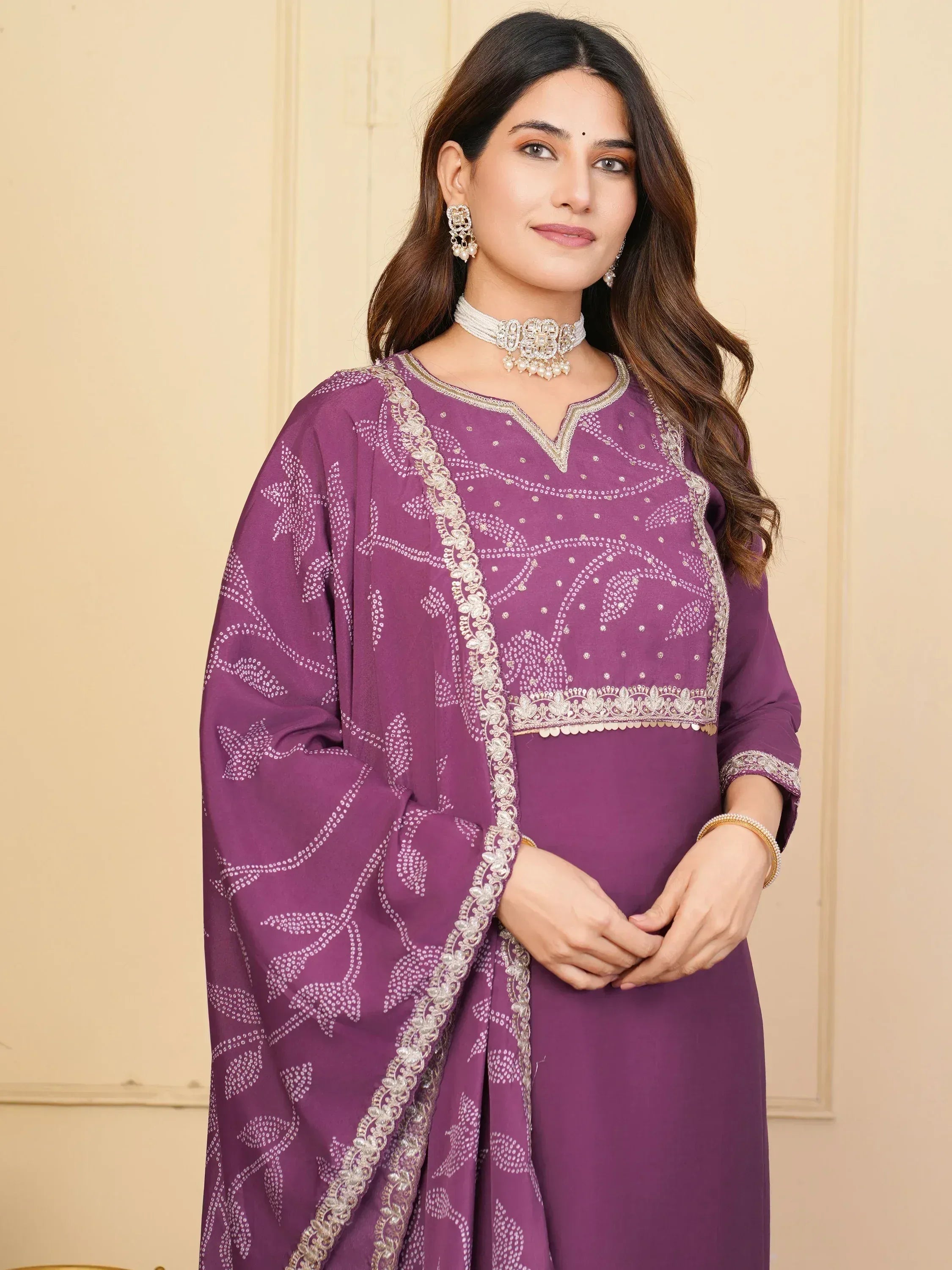 Purple ethnic salwar kameez with white embroidery and gold detailing, perfect for festive occasions