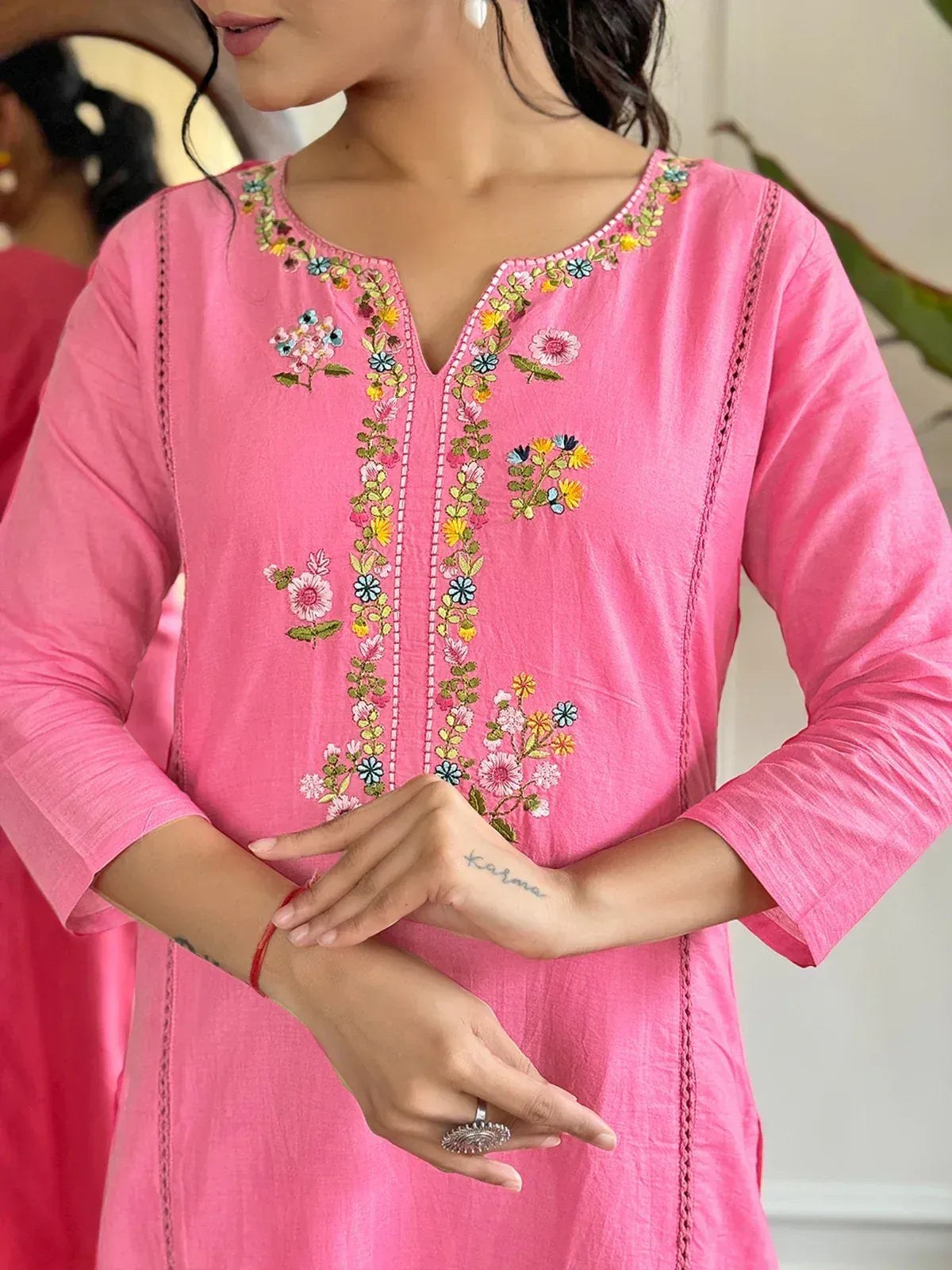 Pink embroidered kurta with floral designs, perfect for ethnic wear