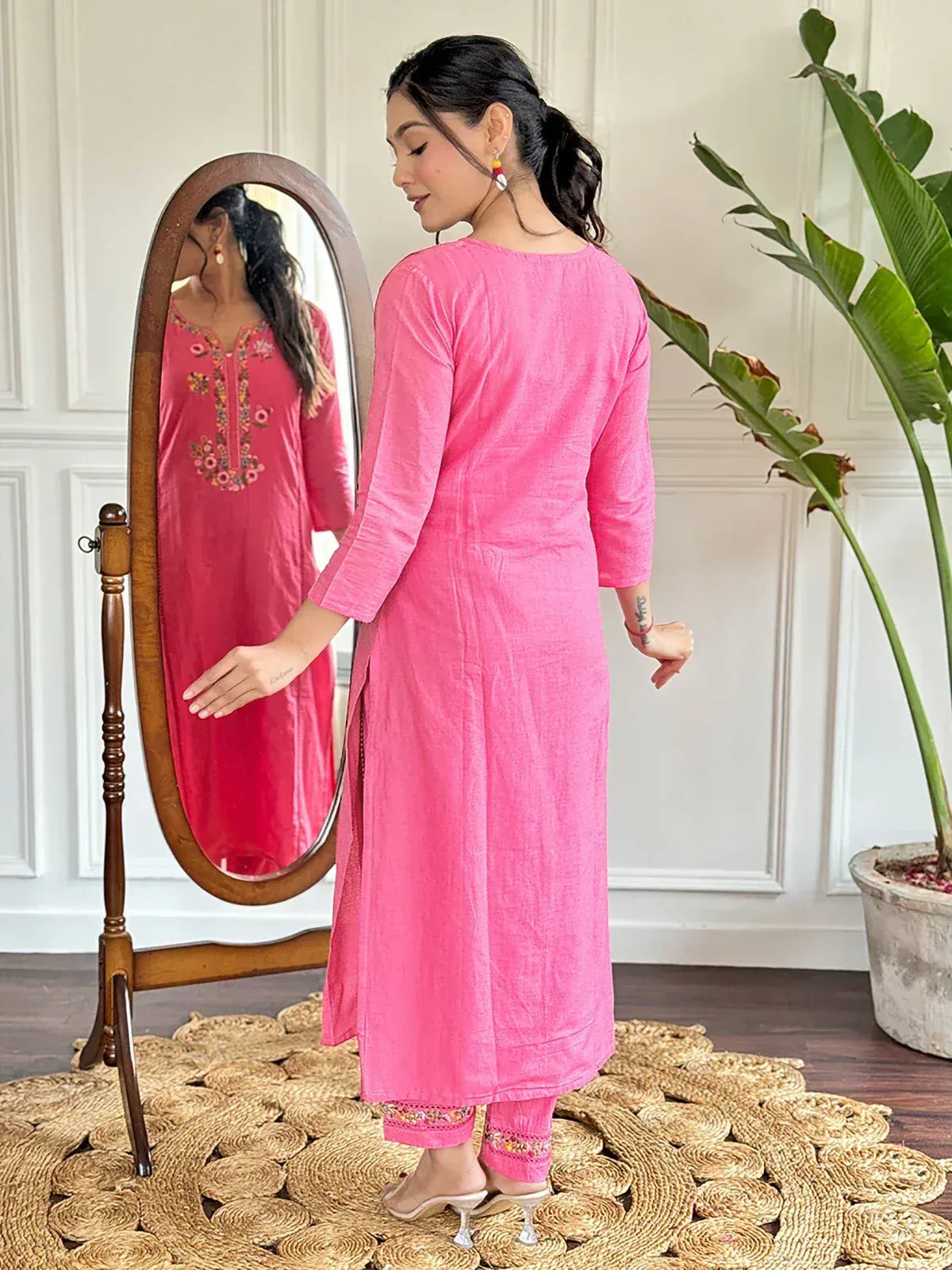 Pink embroidered kurta with matching pants, styled for ethnic wear