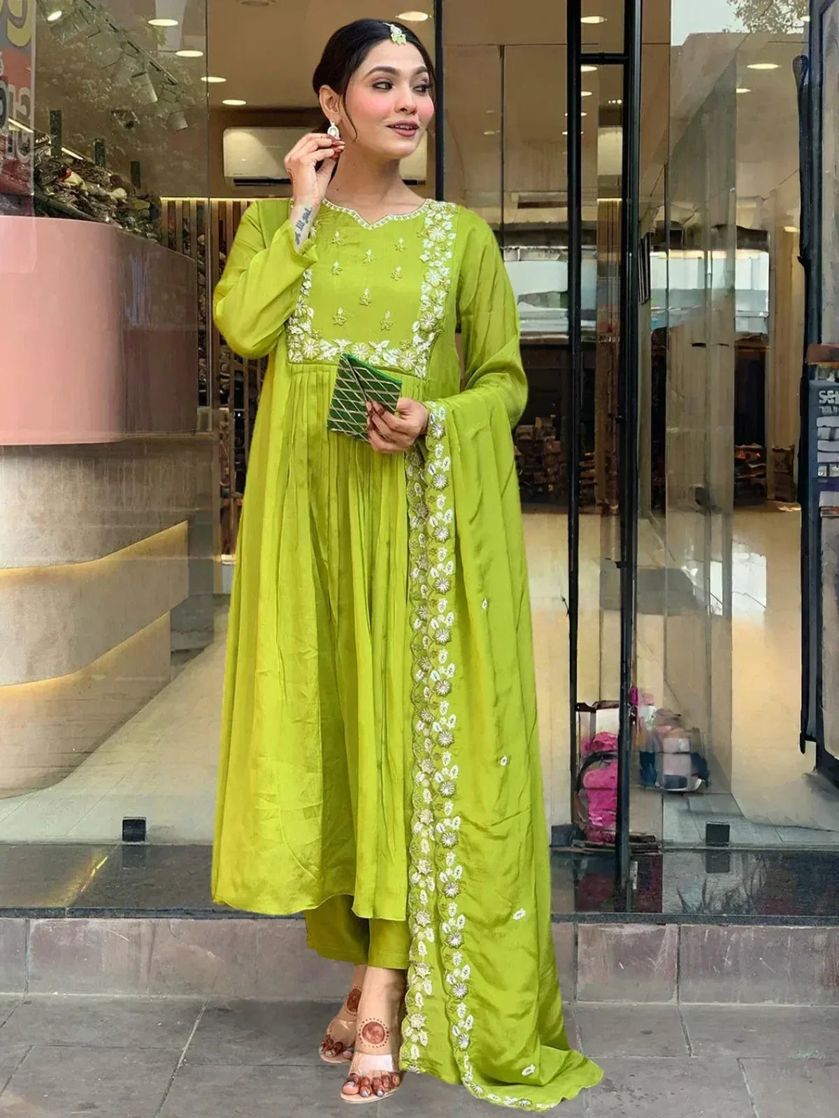 Lime green embroidered salwar kameez with floral detailing, perfect for ethnic wear occasions