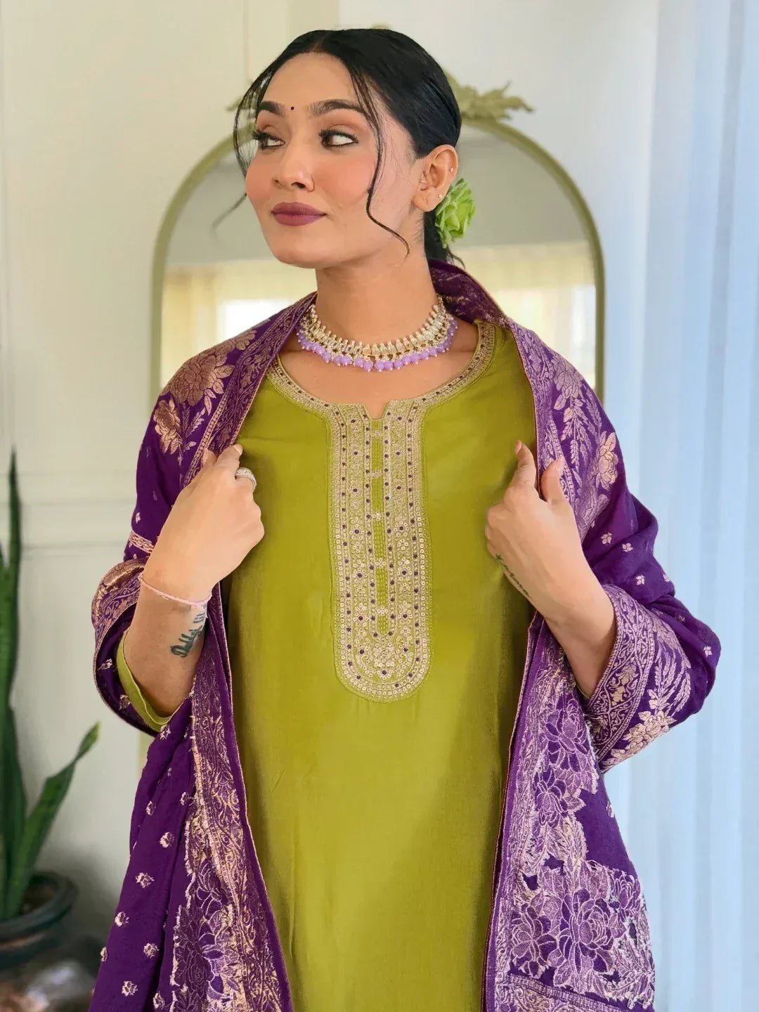 Woman in green embroidered kurta with purple floral dupatta, Indian ethnic wear
