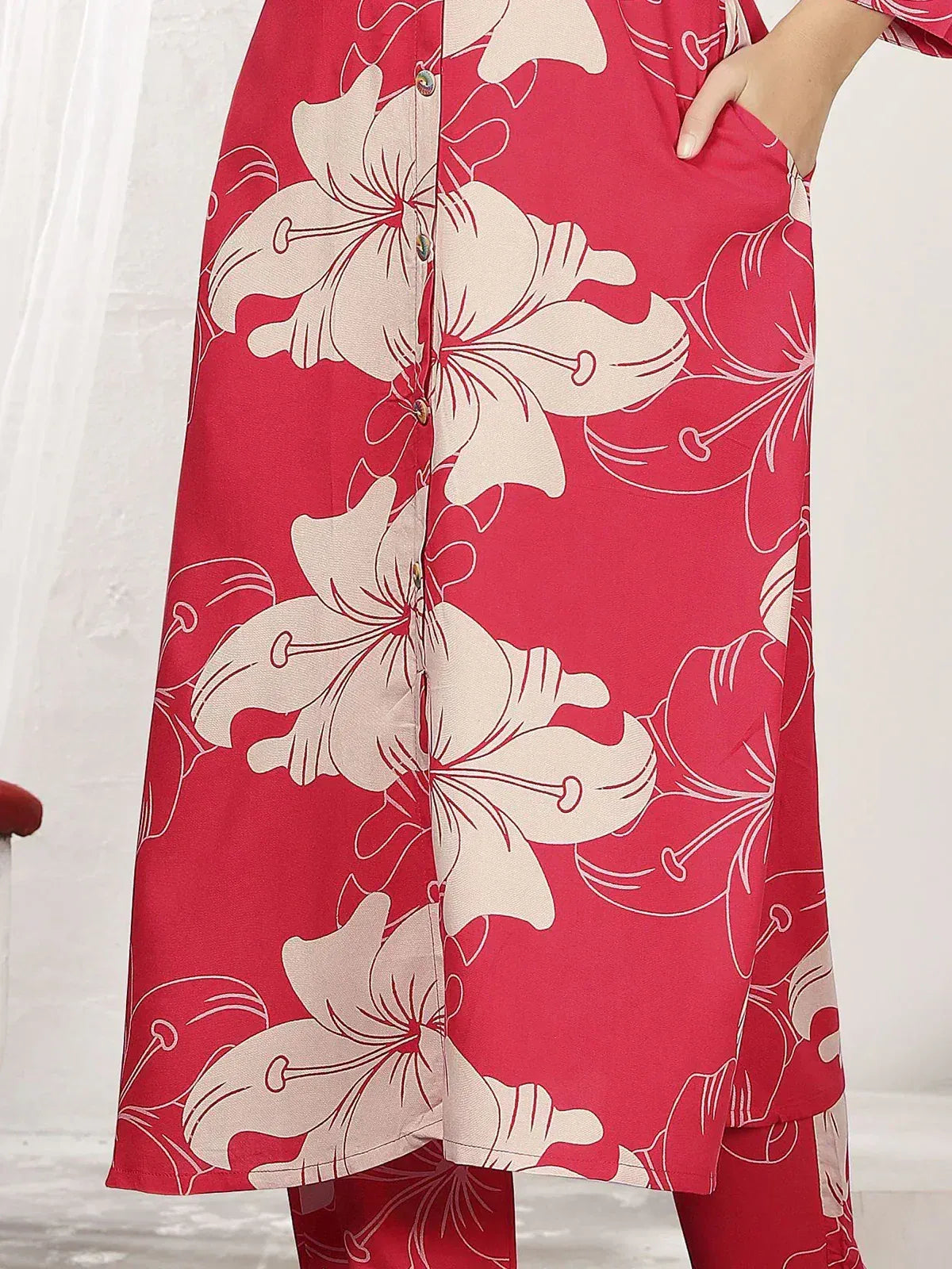 Red floral print ethnic kurta with front buttons and side pocket, paired with matching pants