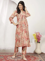 Woman wearing printed floral kurta set, Indian ethnic wear, standing on patterned carpet at Ethnic Plus