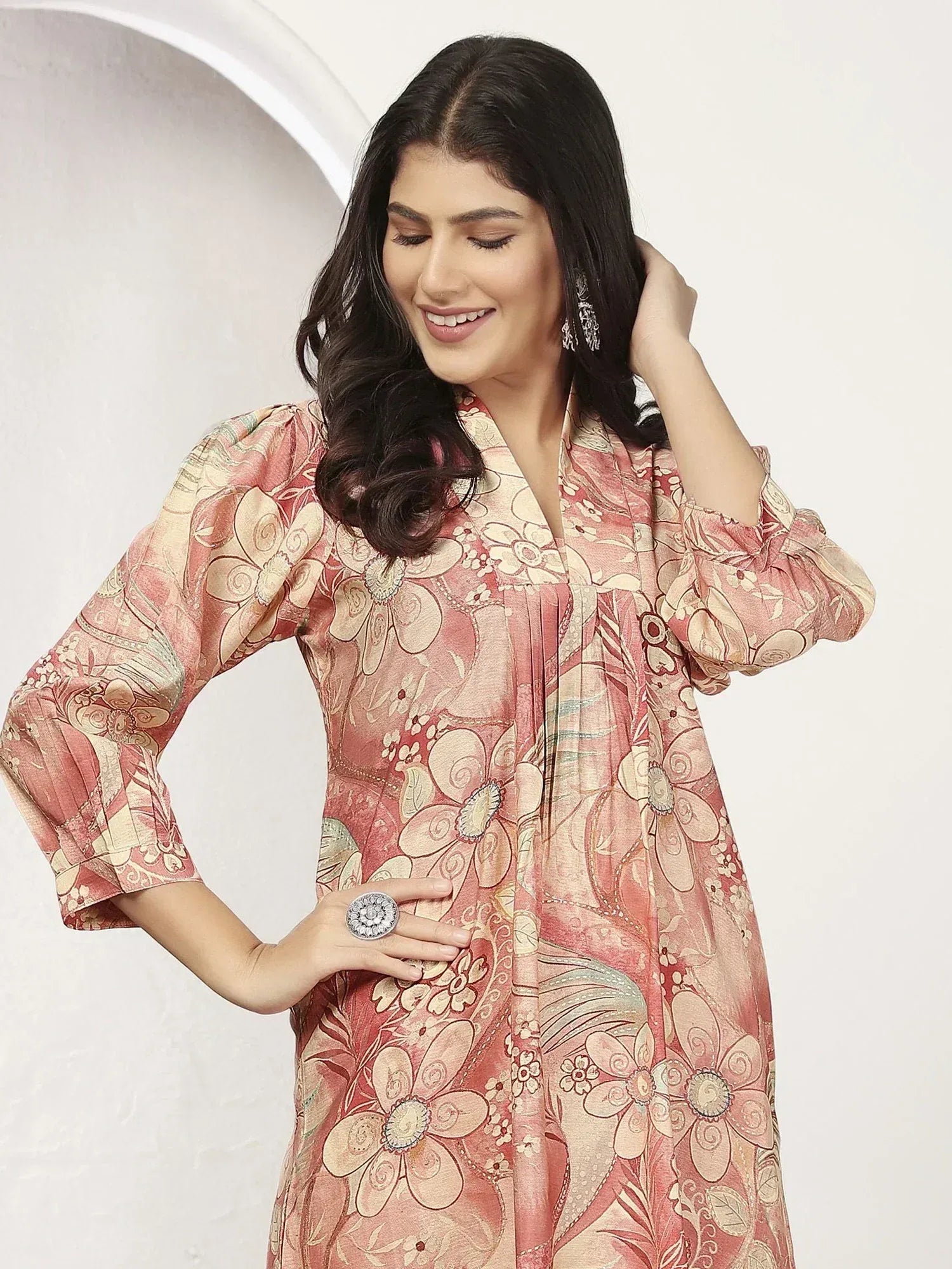 Woman in floral print ethnic kurta with puff sleeves, perfect for Indian occasions and festive wear.