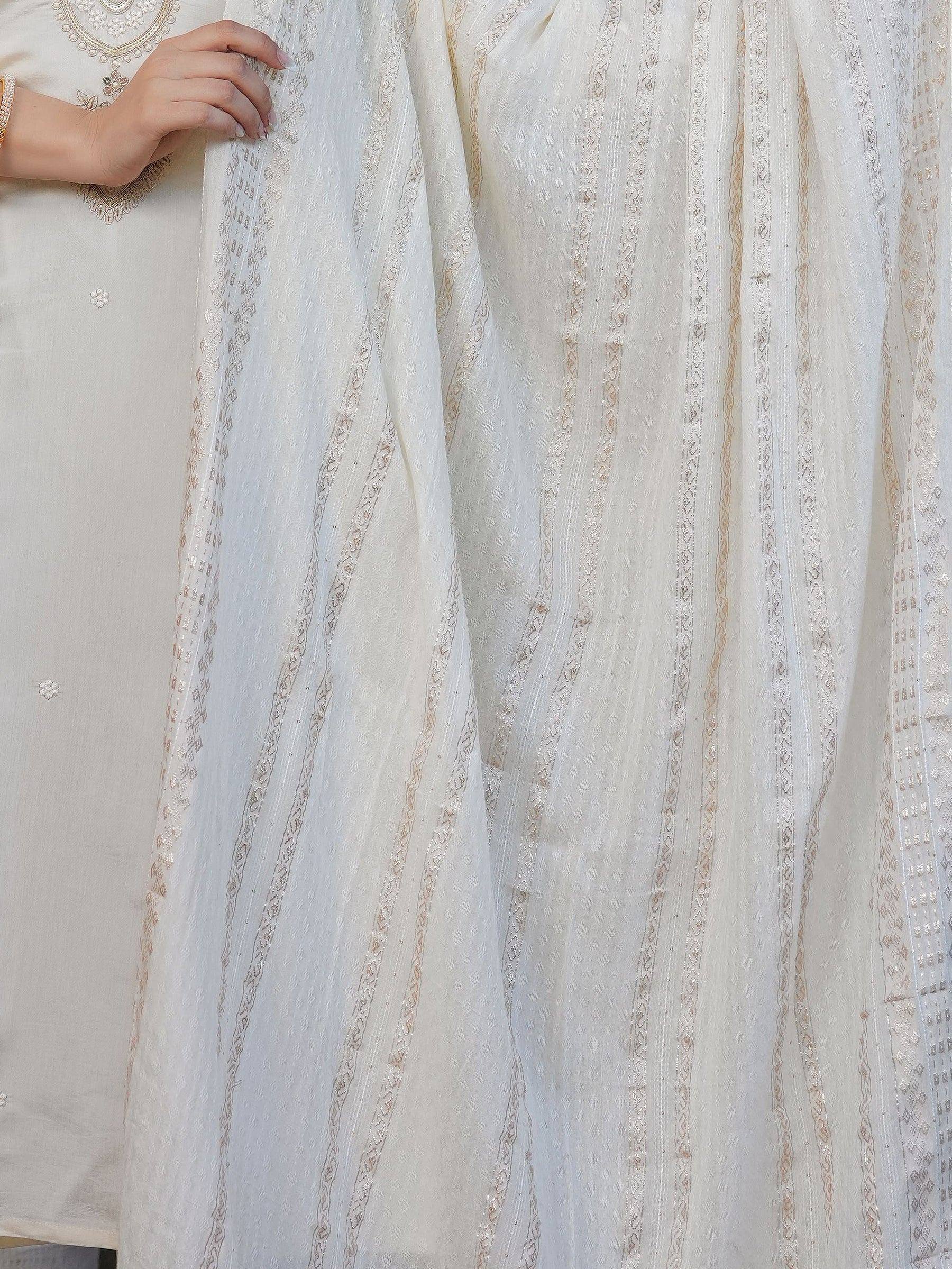 White embroidered salwar kameez with sheer dupatta, intricate gold thread work, ethnic Indian wear