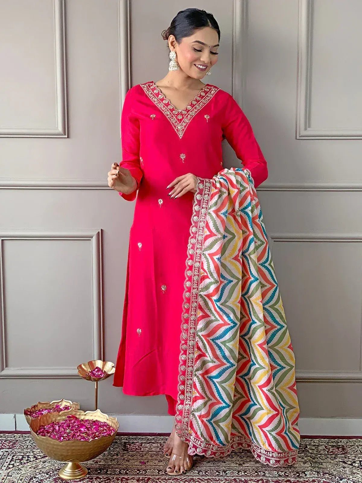 Vibrant pink embroidered kurta with colorful geometric dupatta, ethnic Indian wear for festive occasions
