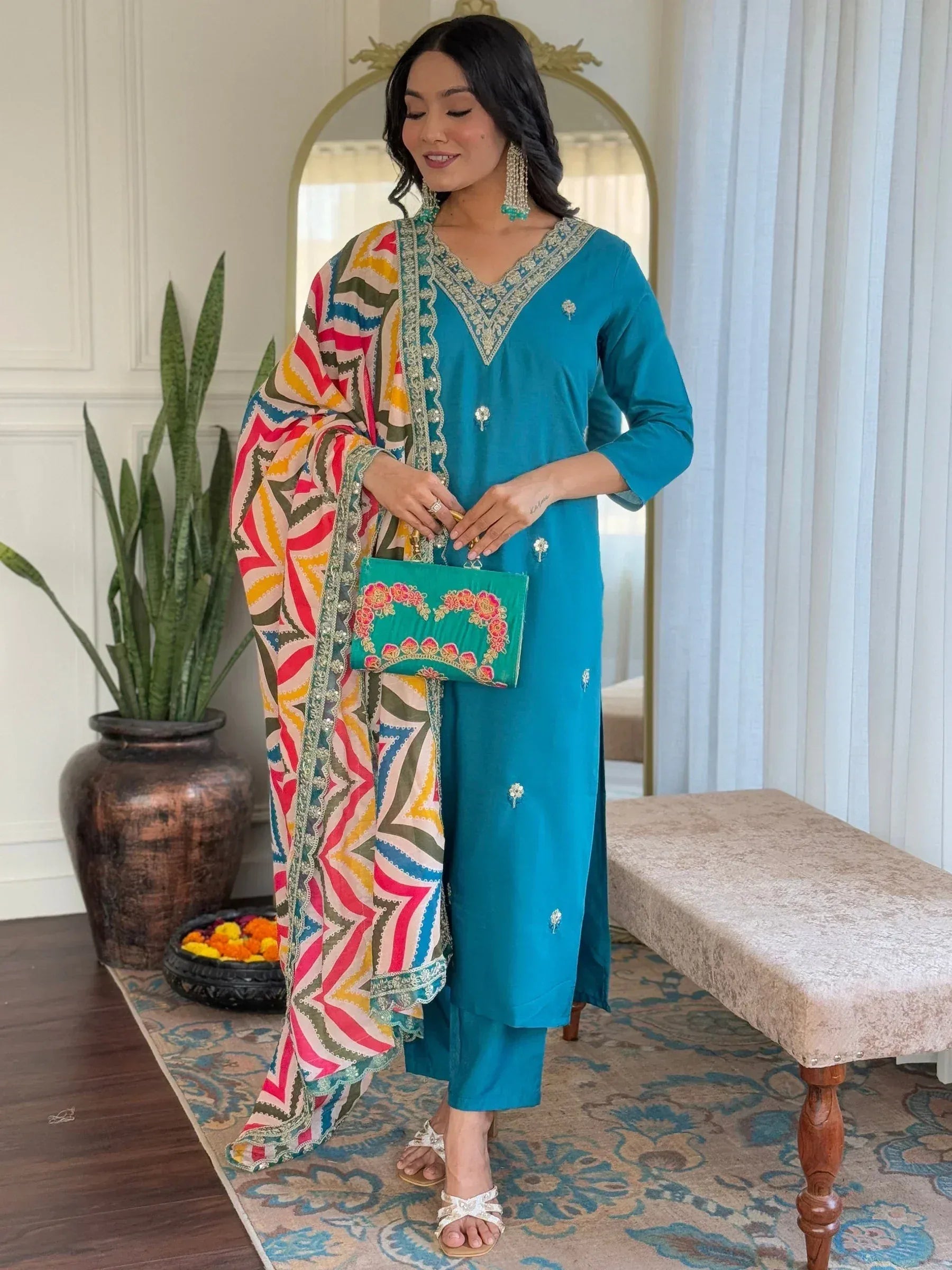 Teal embroidered salwar kameez with colorful geometric dupatta, perfect for Indian ethnic wear