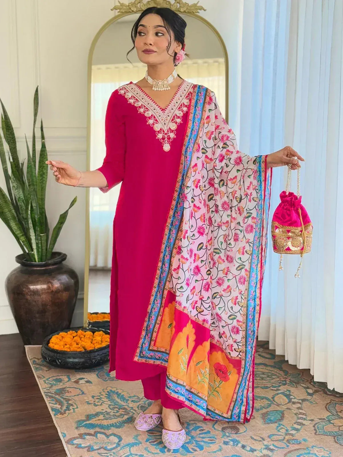 Pink embroidered salwar kameez with floral dupatta and potli bag, Indian ethnic wear