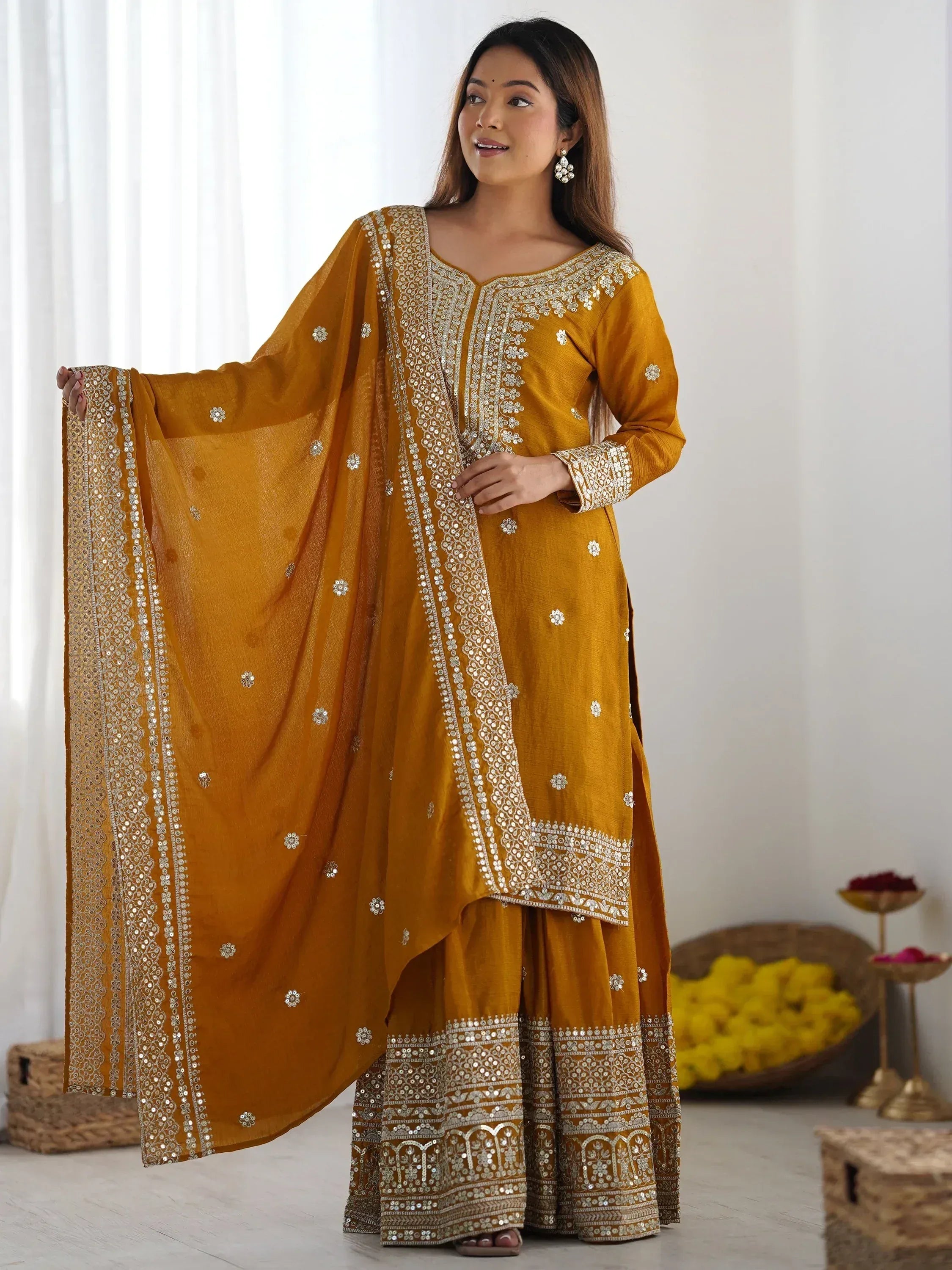 Mustard yellow embroidered salwar kameez with mirror work, perfect for Indian ethnic occasions